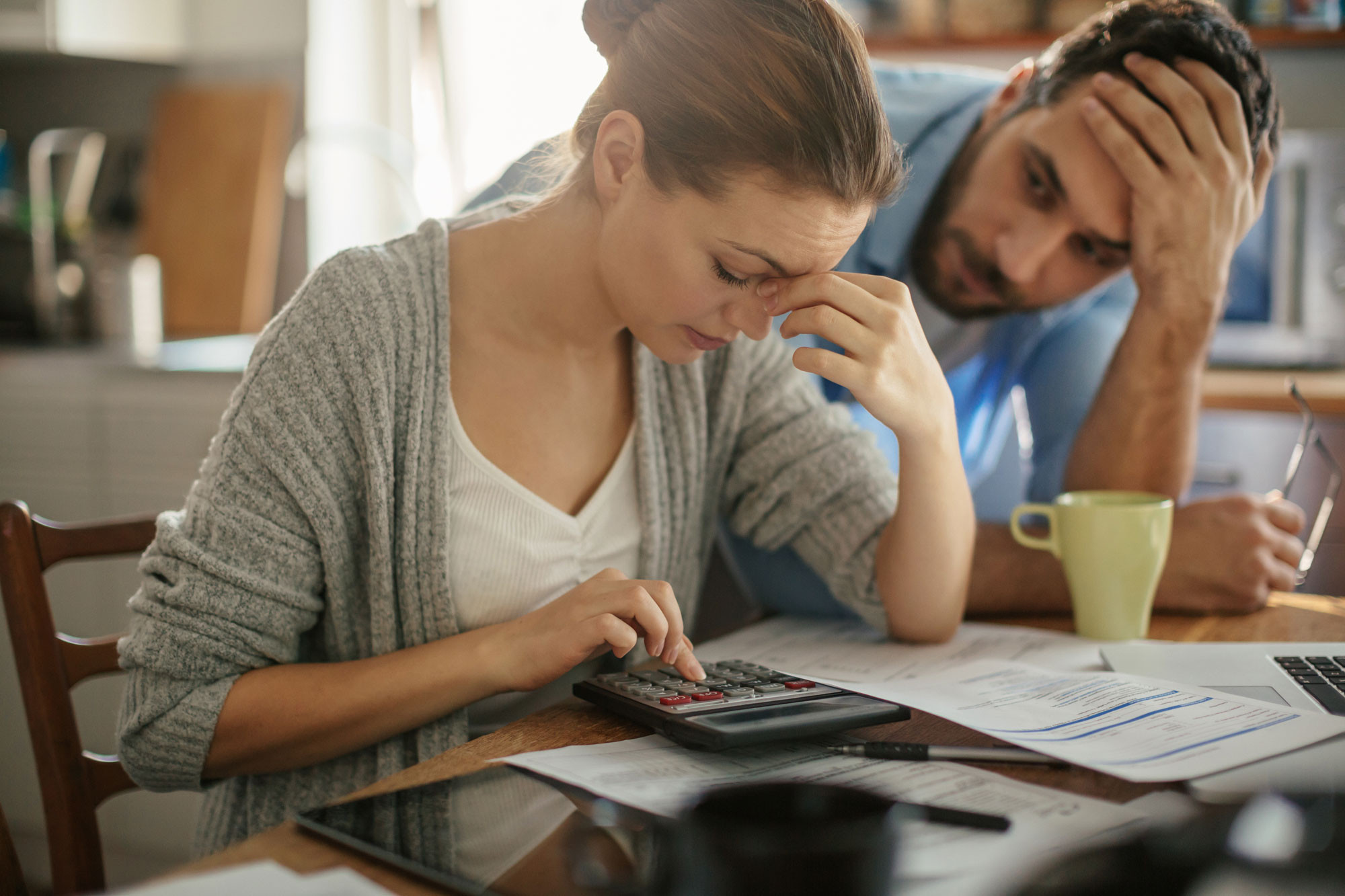 stressed couple at financial calculating work