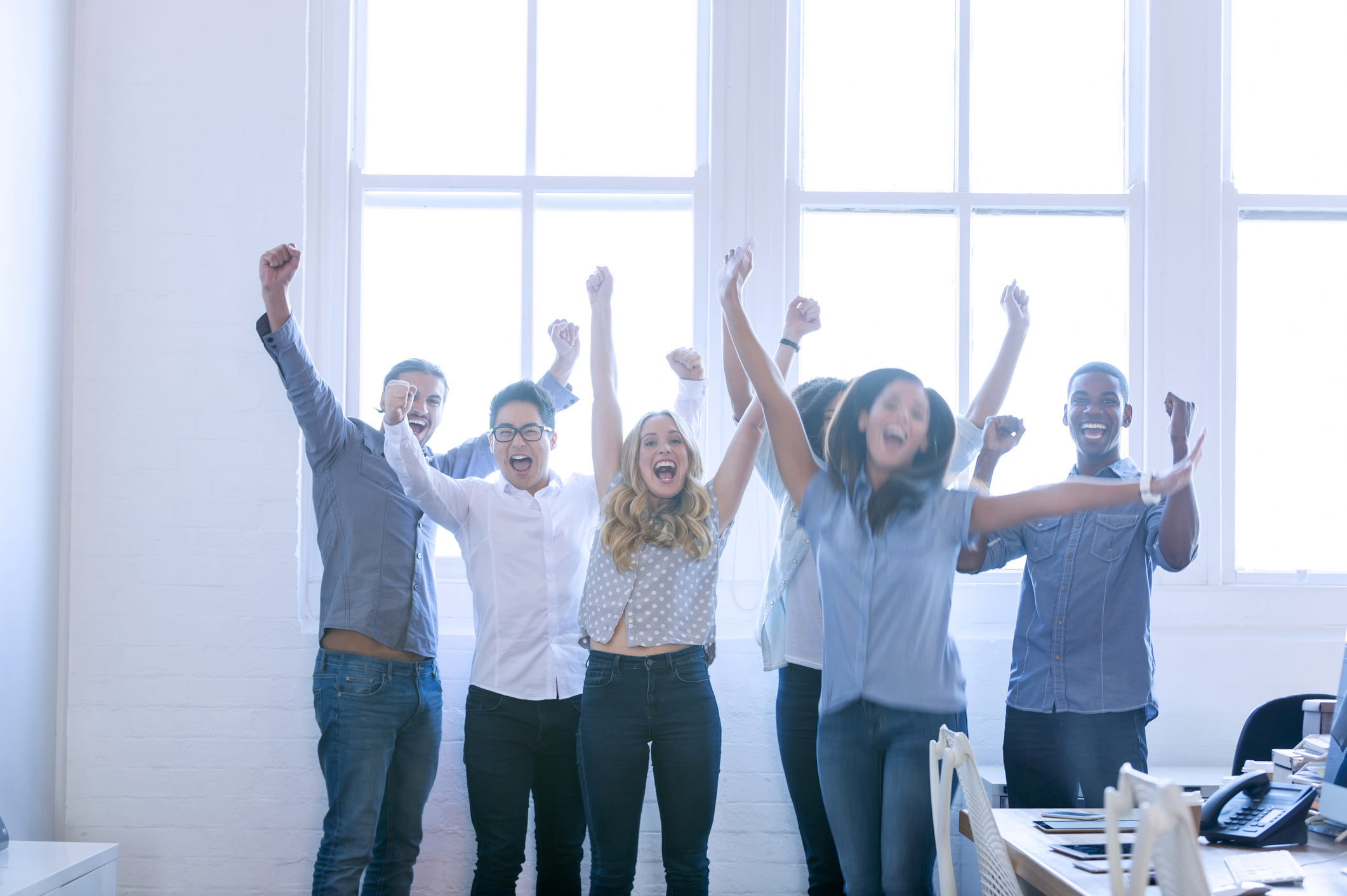 Cheering group of business people