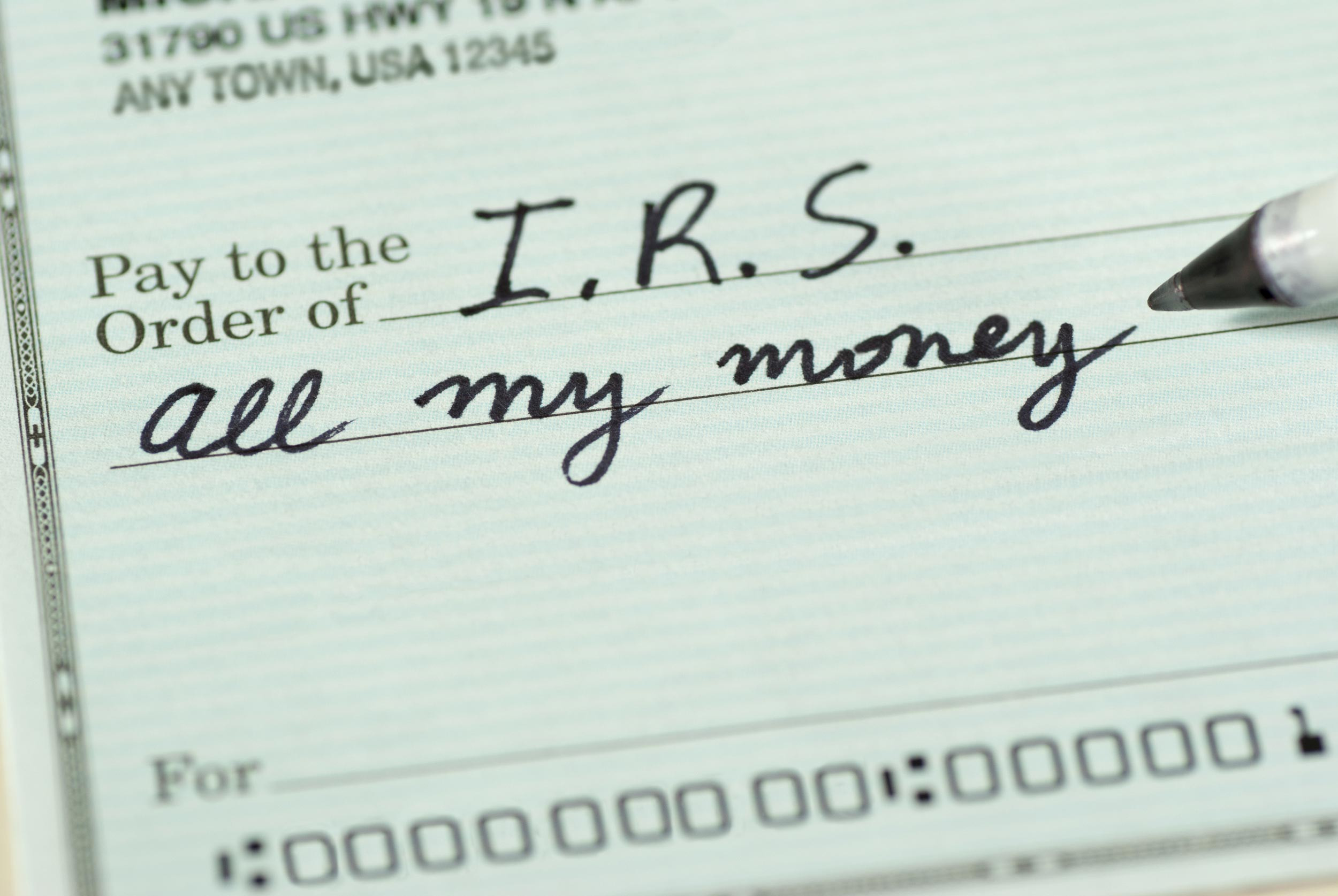 IRS payment with check writing pen