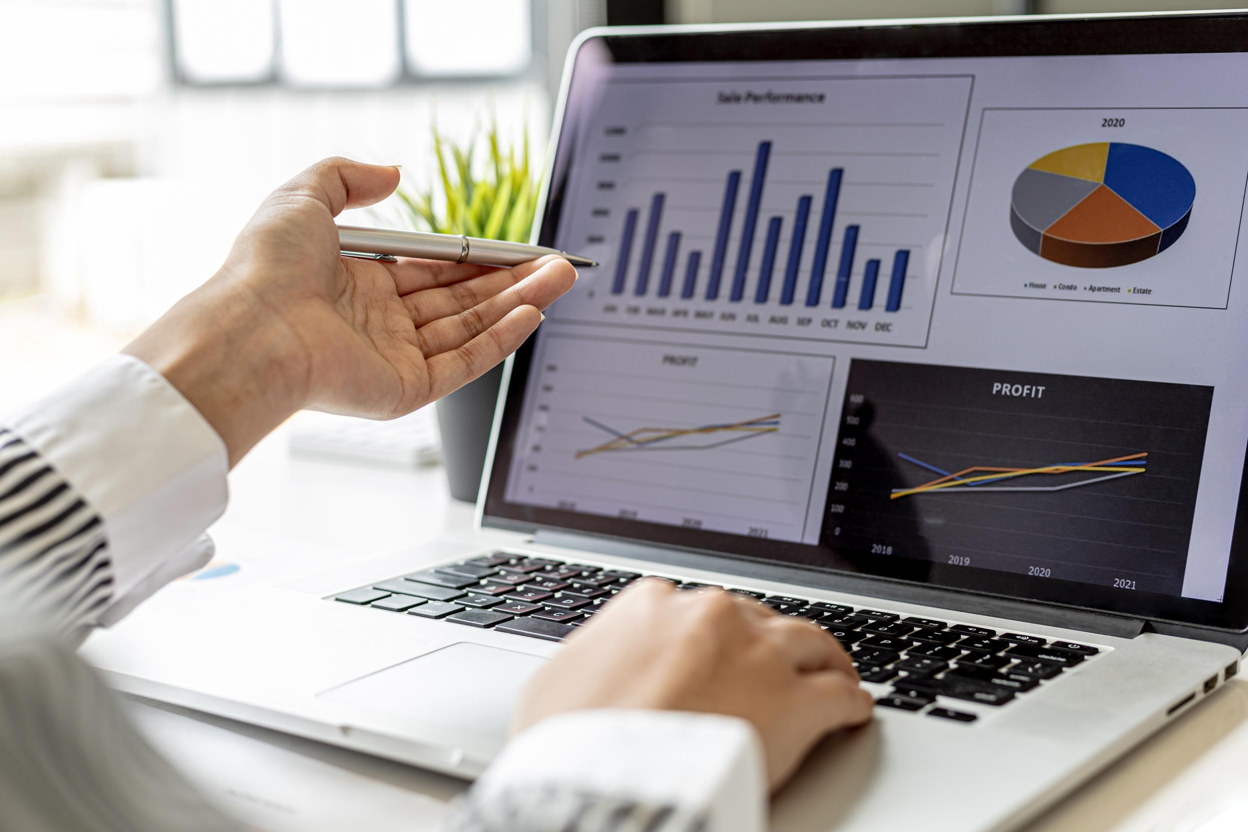 laptop screen with data analytics graphs and charts