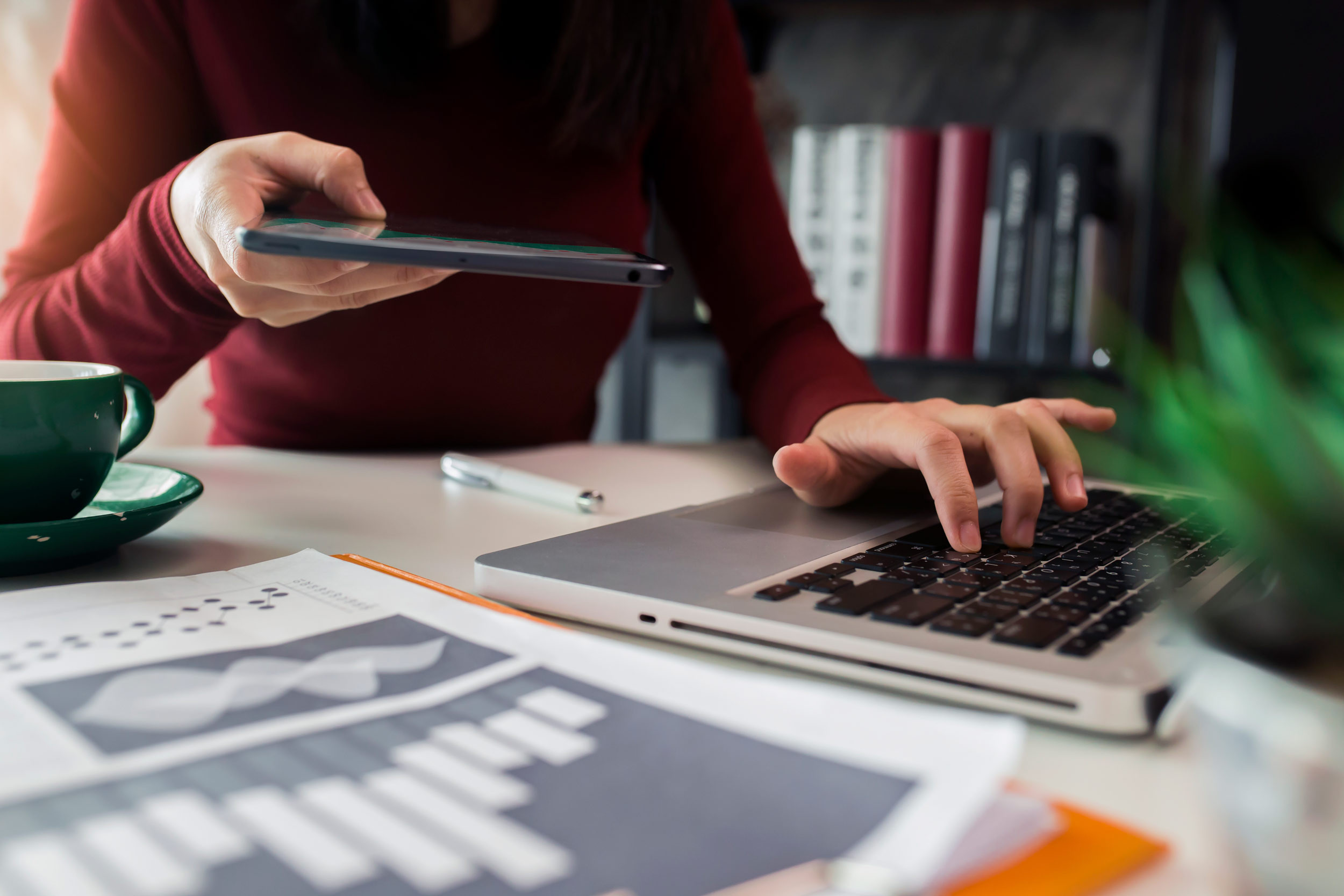 virtual accounting paper with computer and phone on table