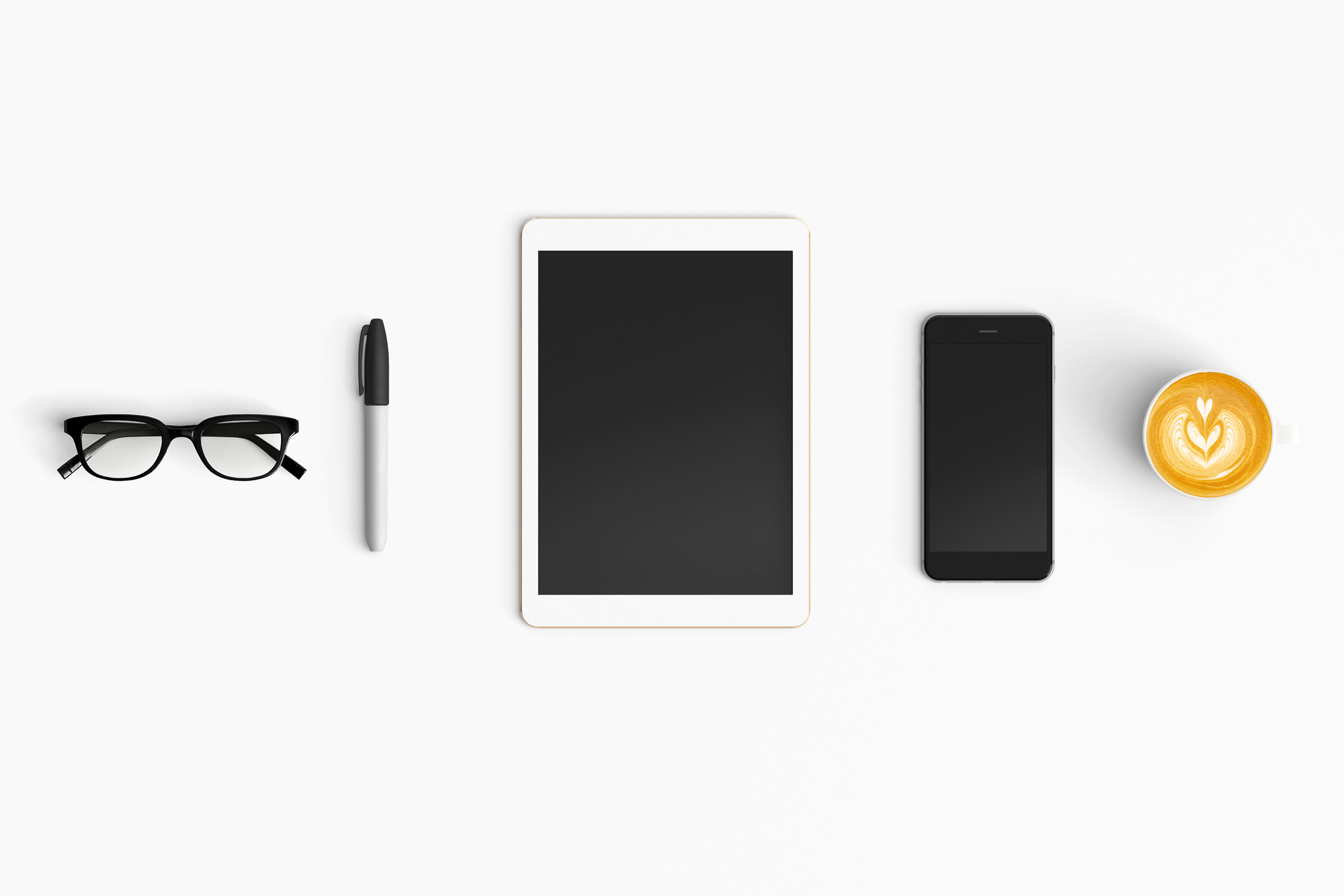 Various technology devices on a desk