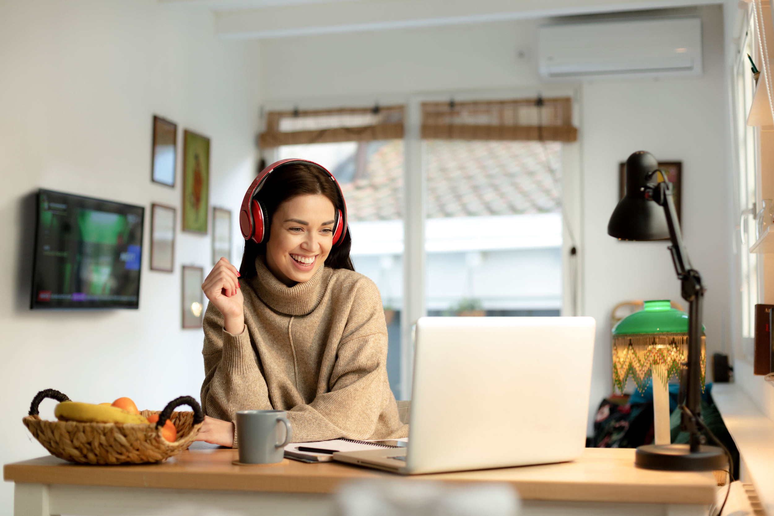 happy person in headset making virtual video call on computer