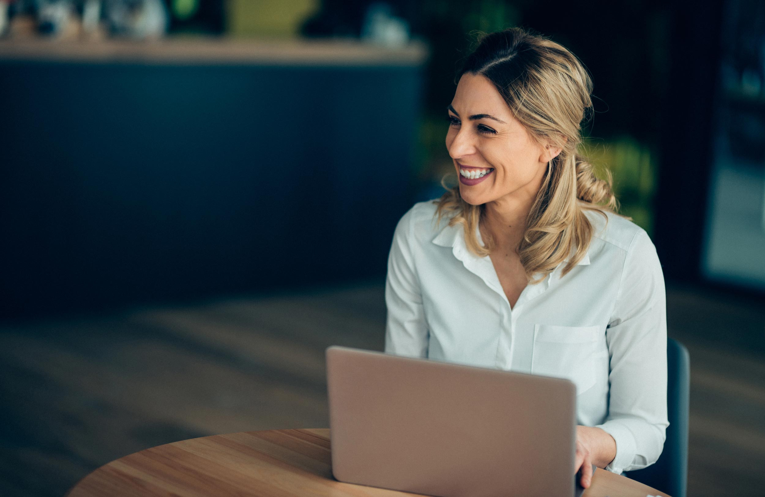 a happy person working on the computer