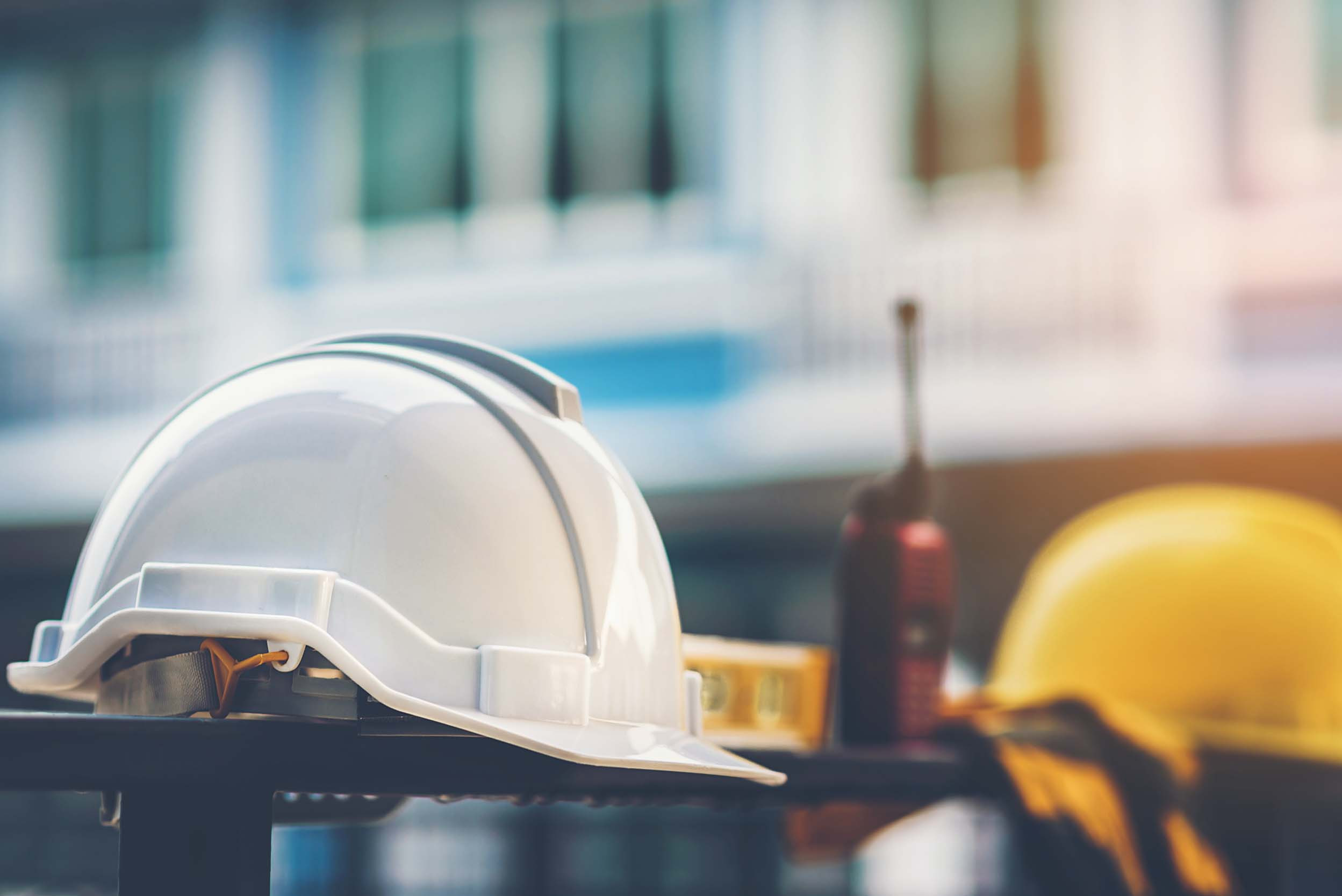 business construction hard hat on background