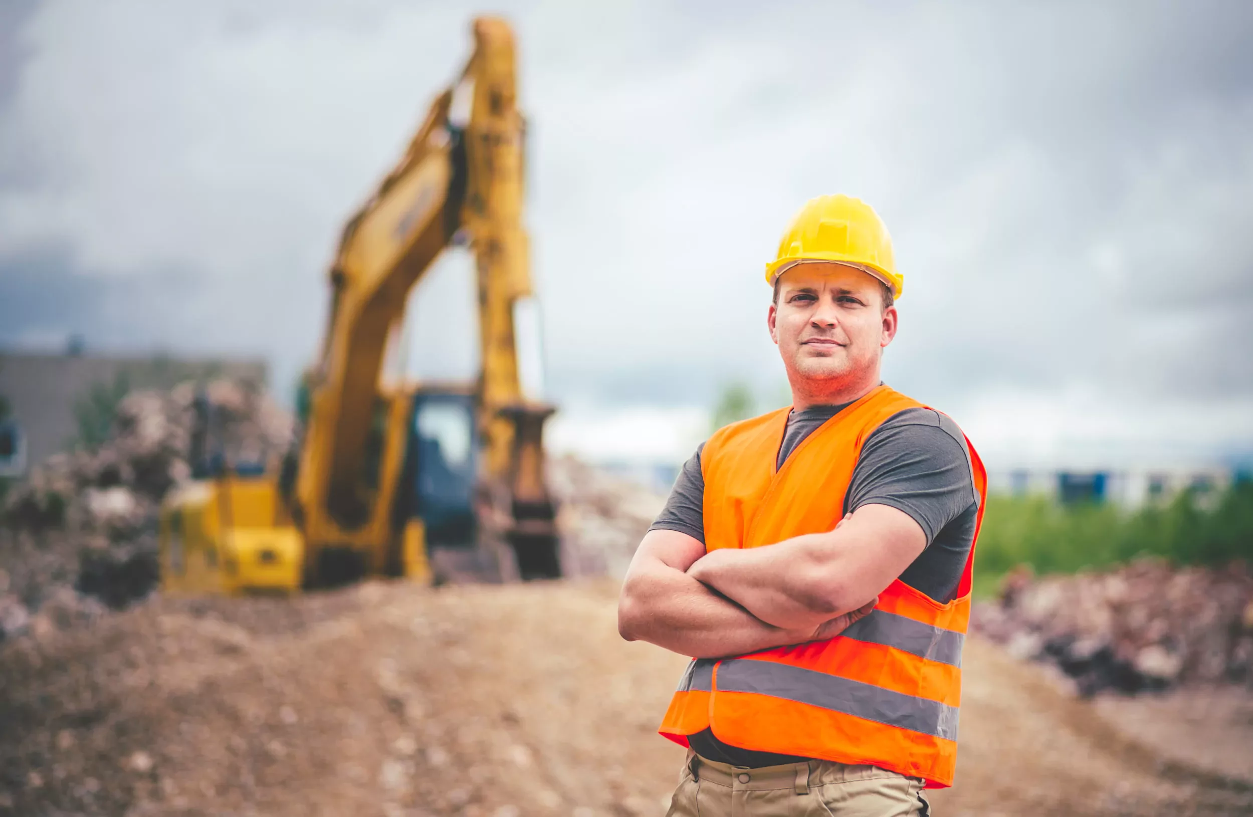 earth digger driver at construction site