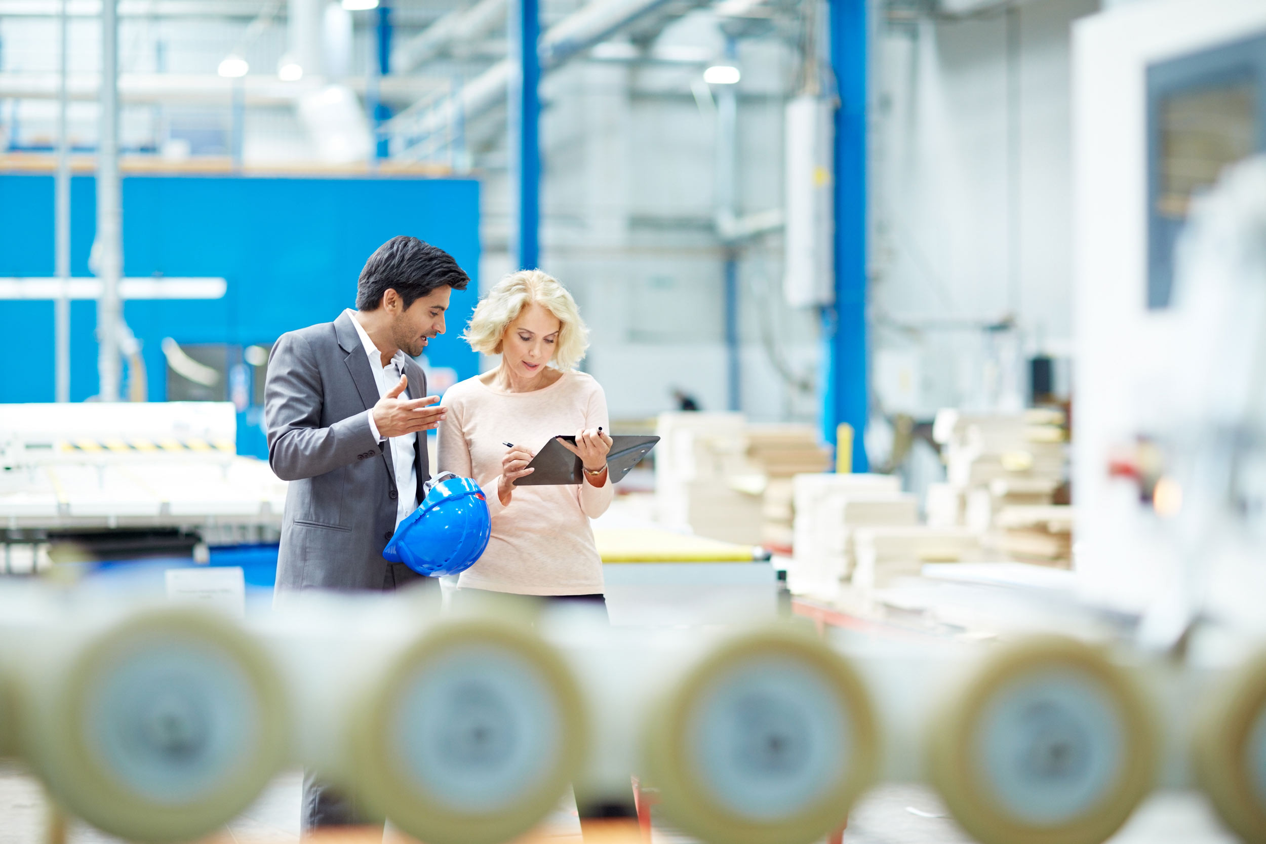 two persons checking the internal control and making notes of it