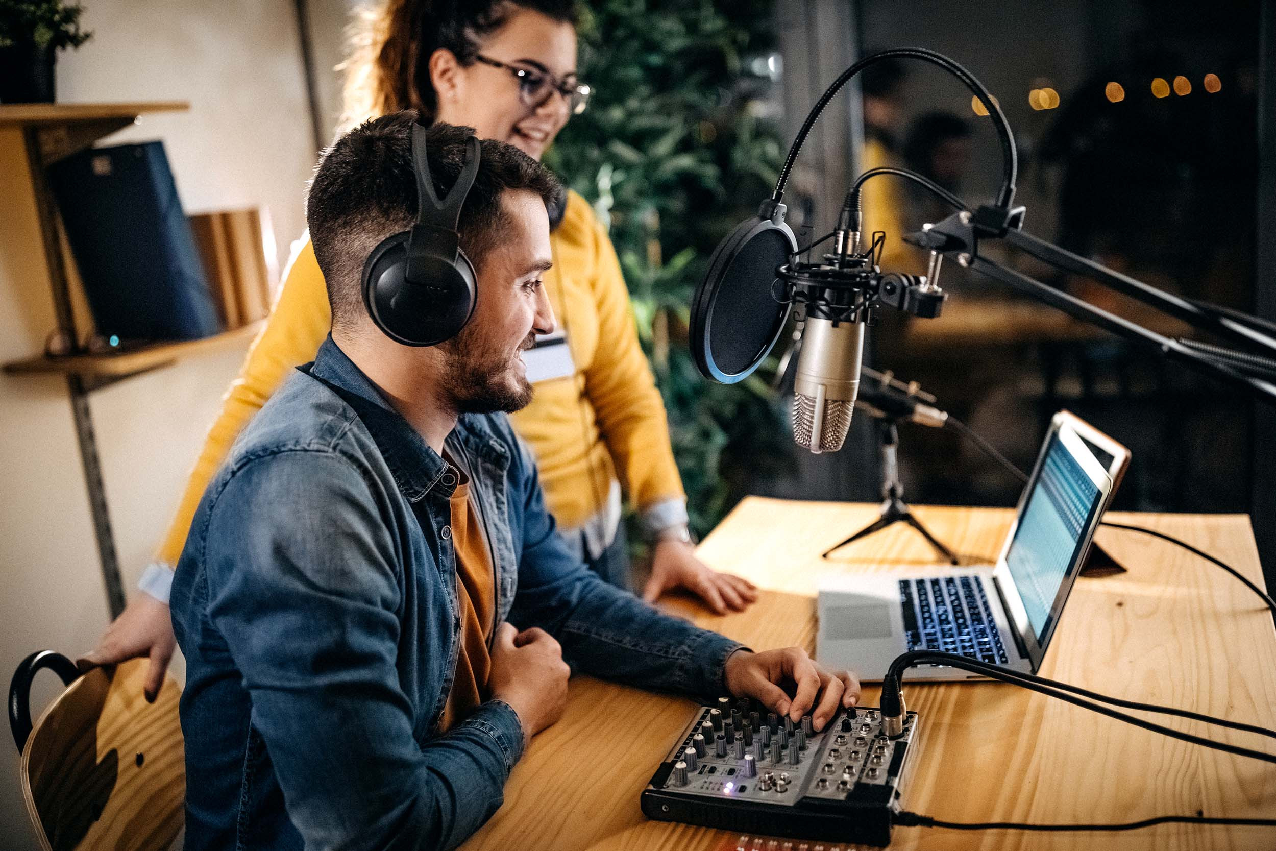 media podcast looking at computer