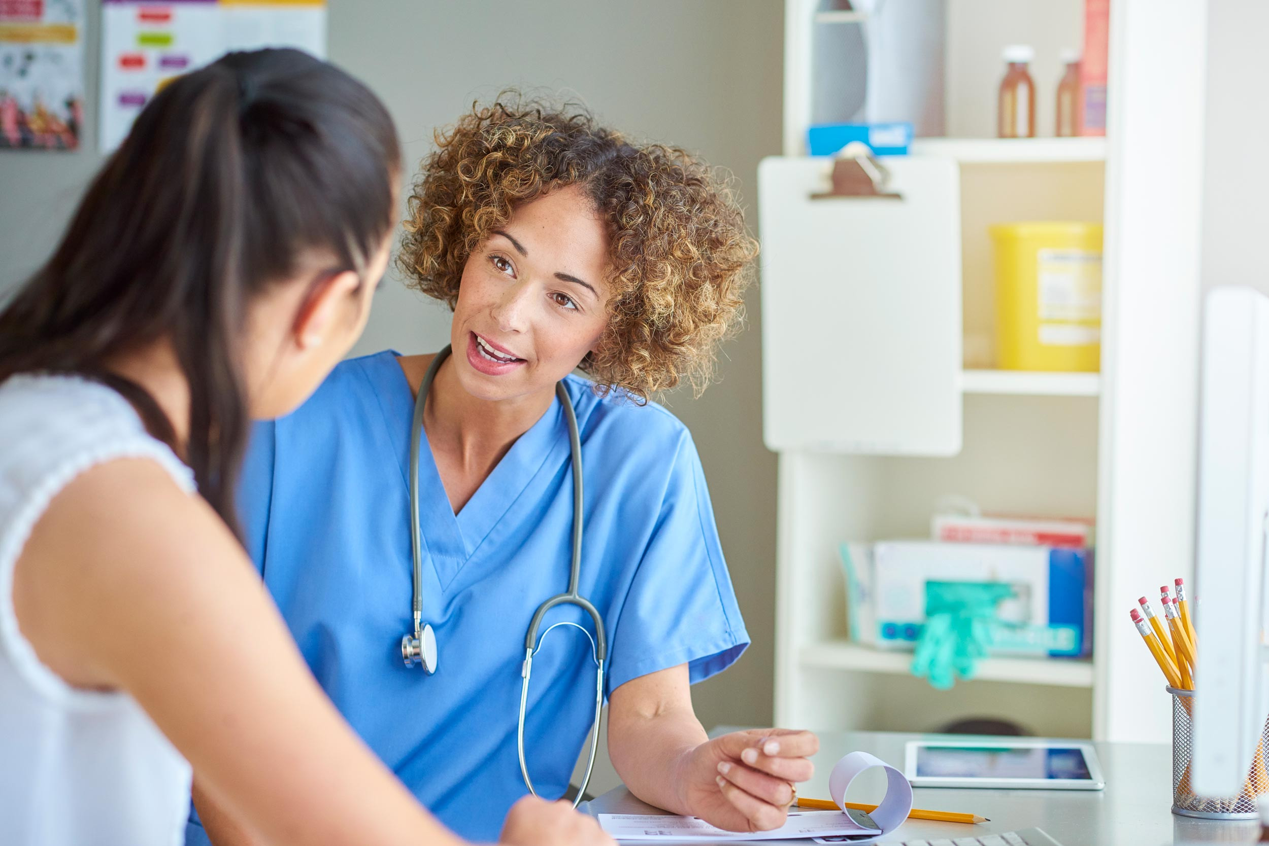 healthcare doctor happily chatting to patient