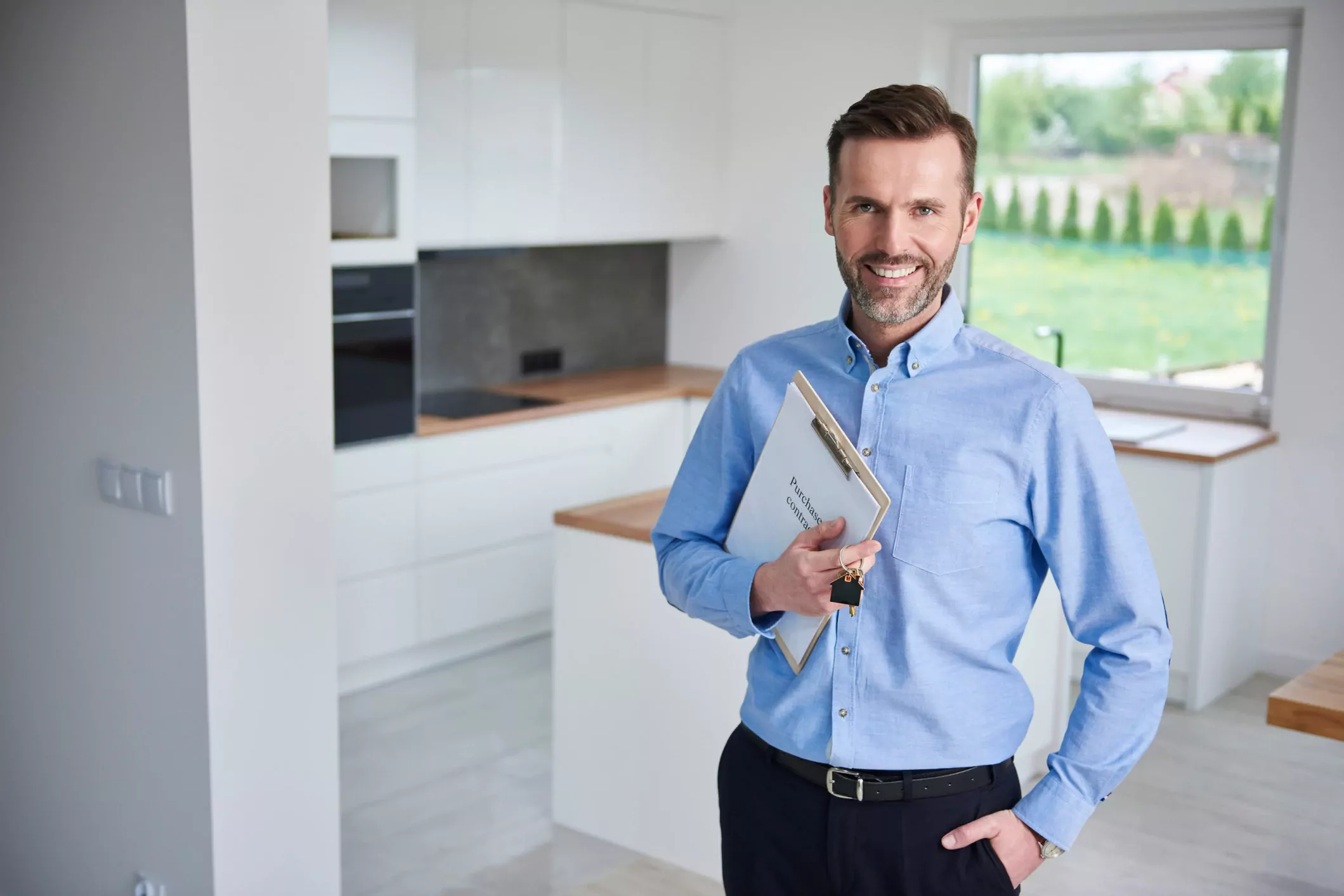 real estate agent holding clipart and standing at house 