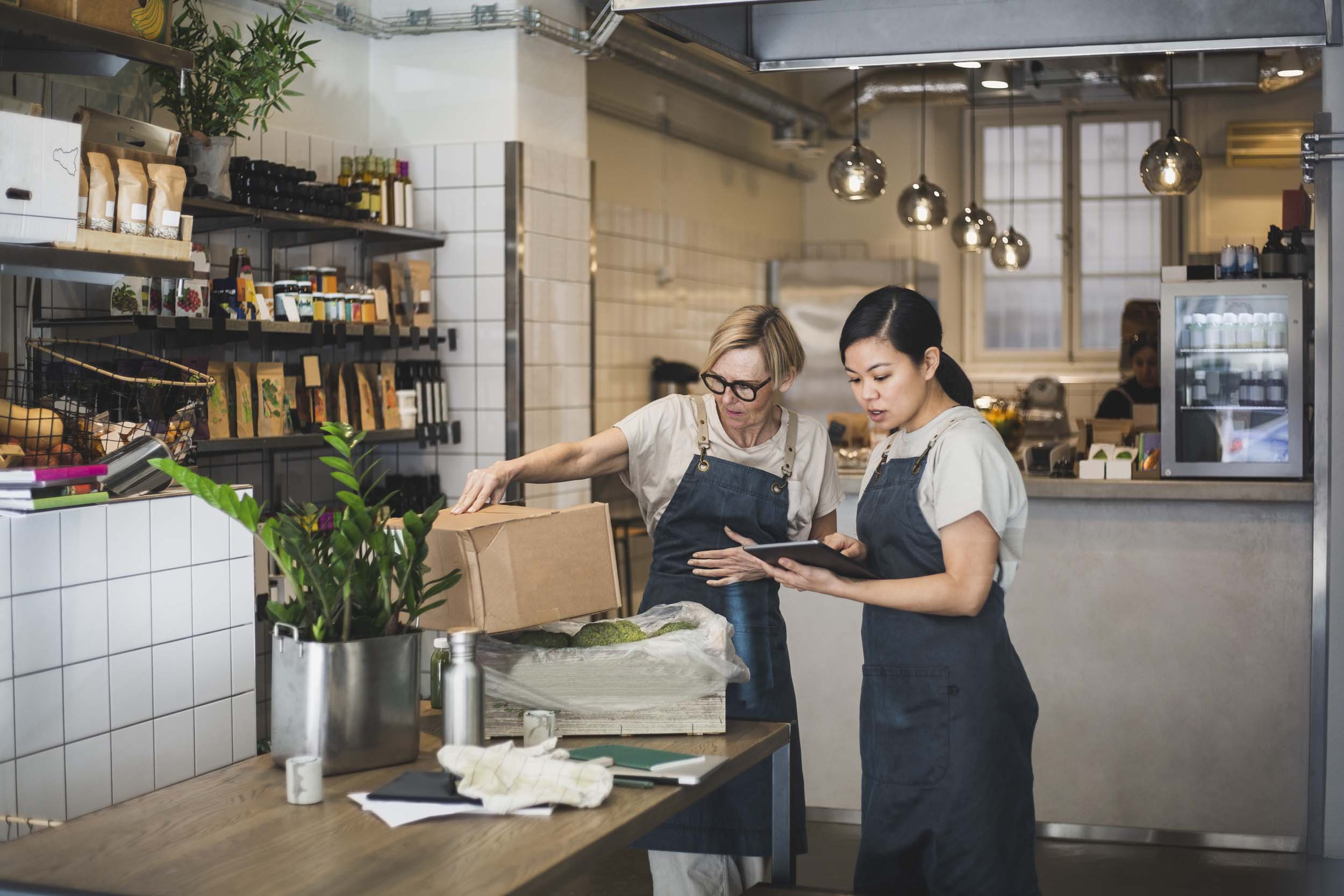 business person using tablet at restaurant cafe