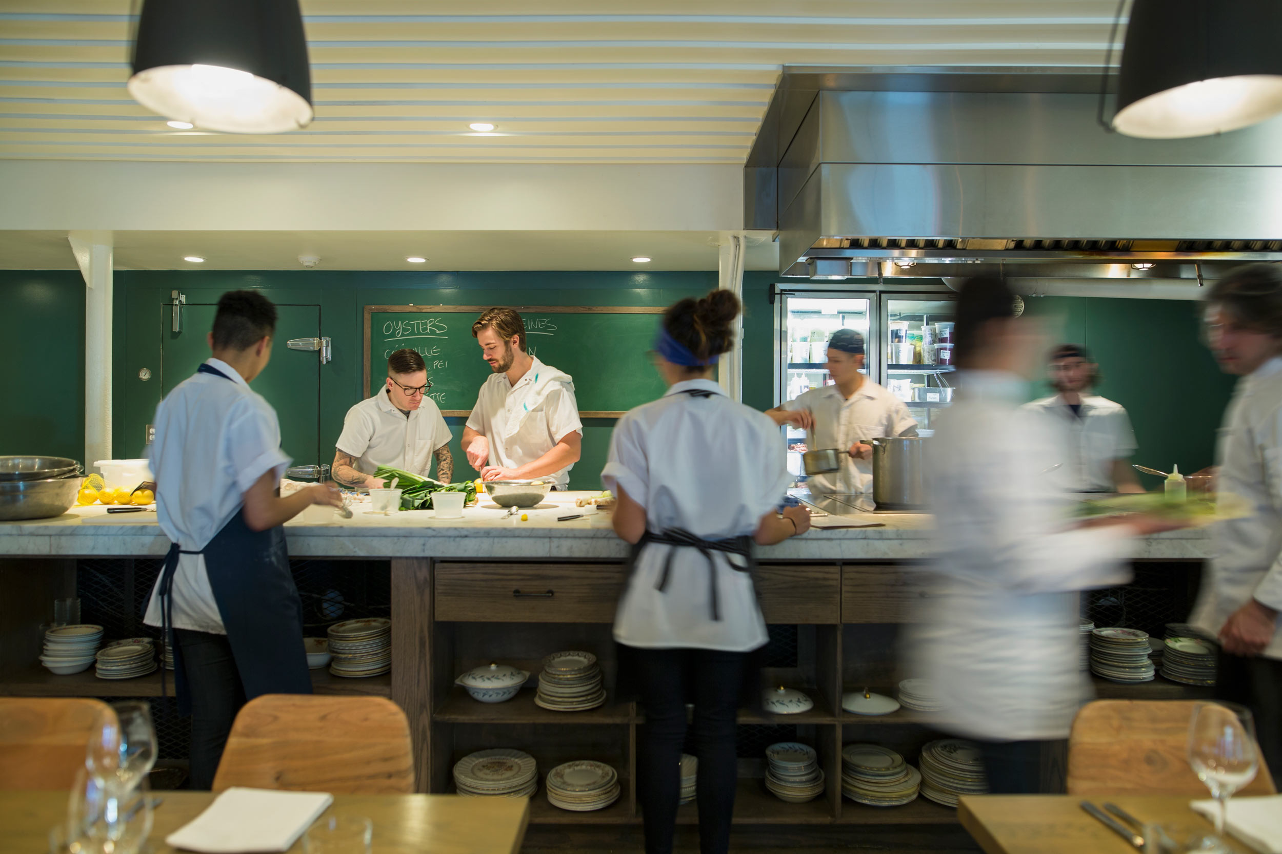 restaurant staff standing at kitchen