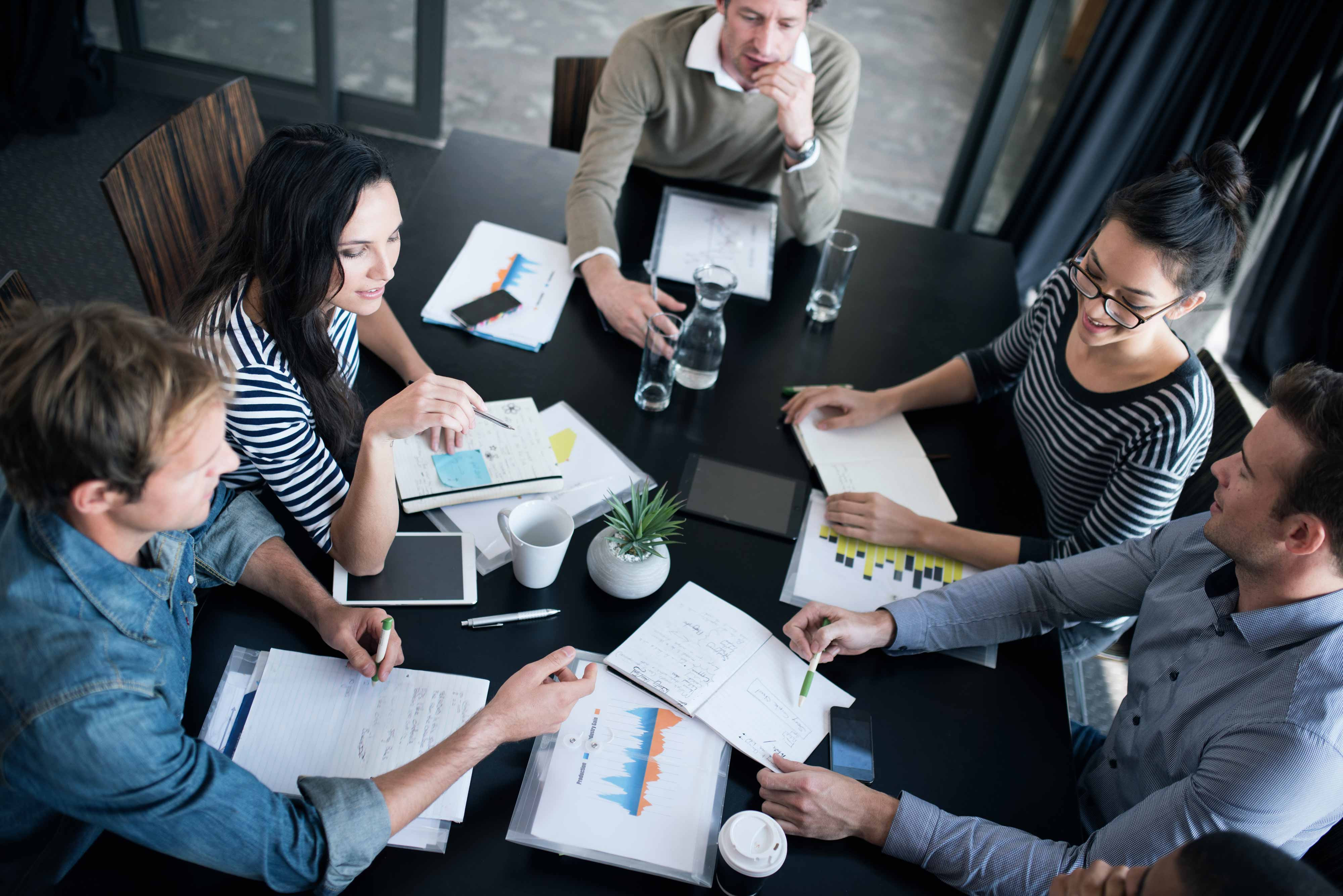 group of people attending the meeting in office