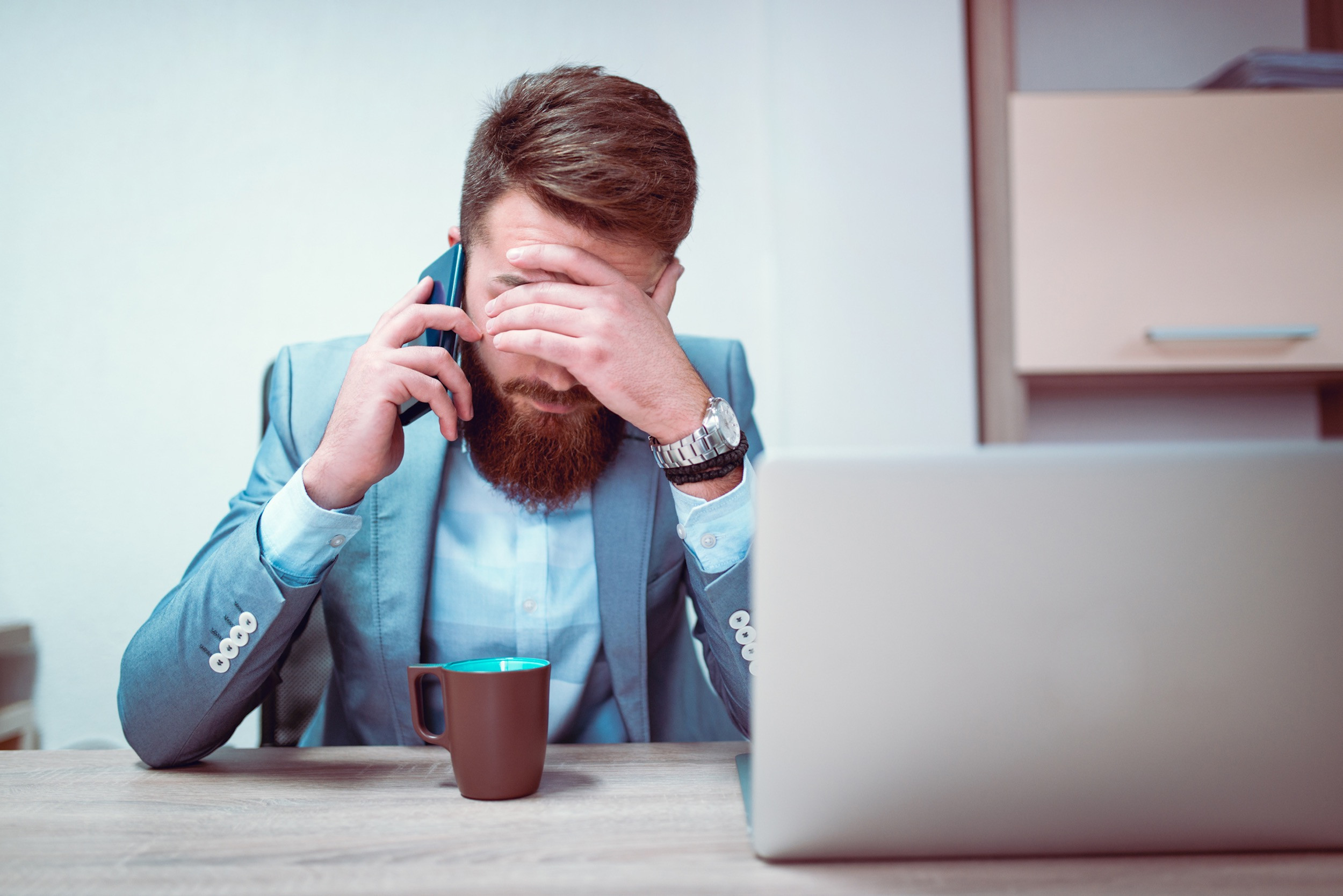 business person stressed with work at desk