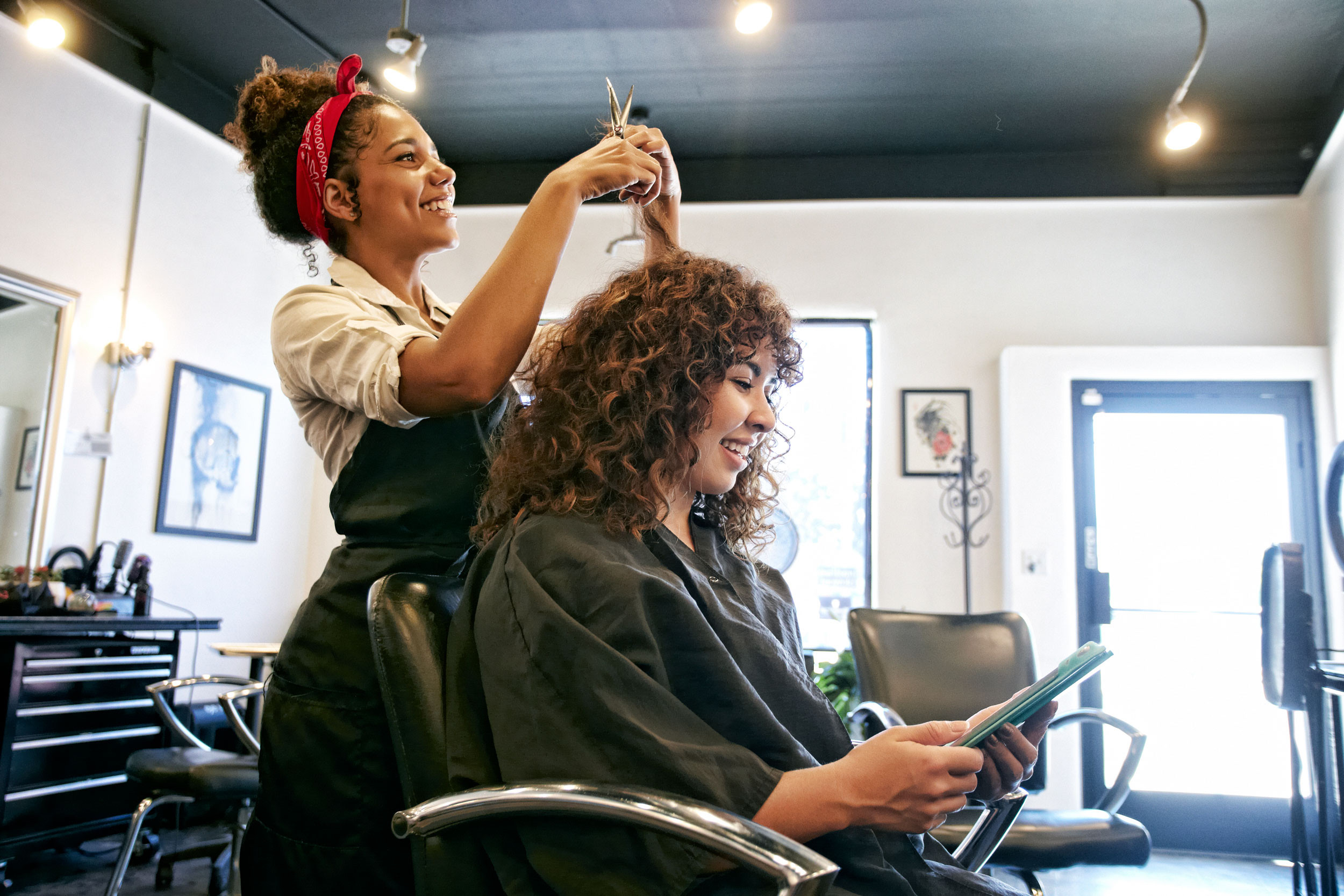 salon person in a barber shop chair the hairdresser serves the client in the barber shop