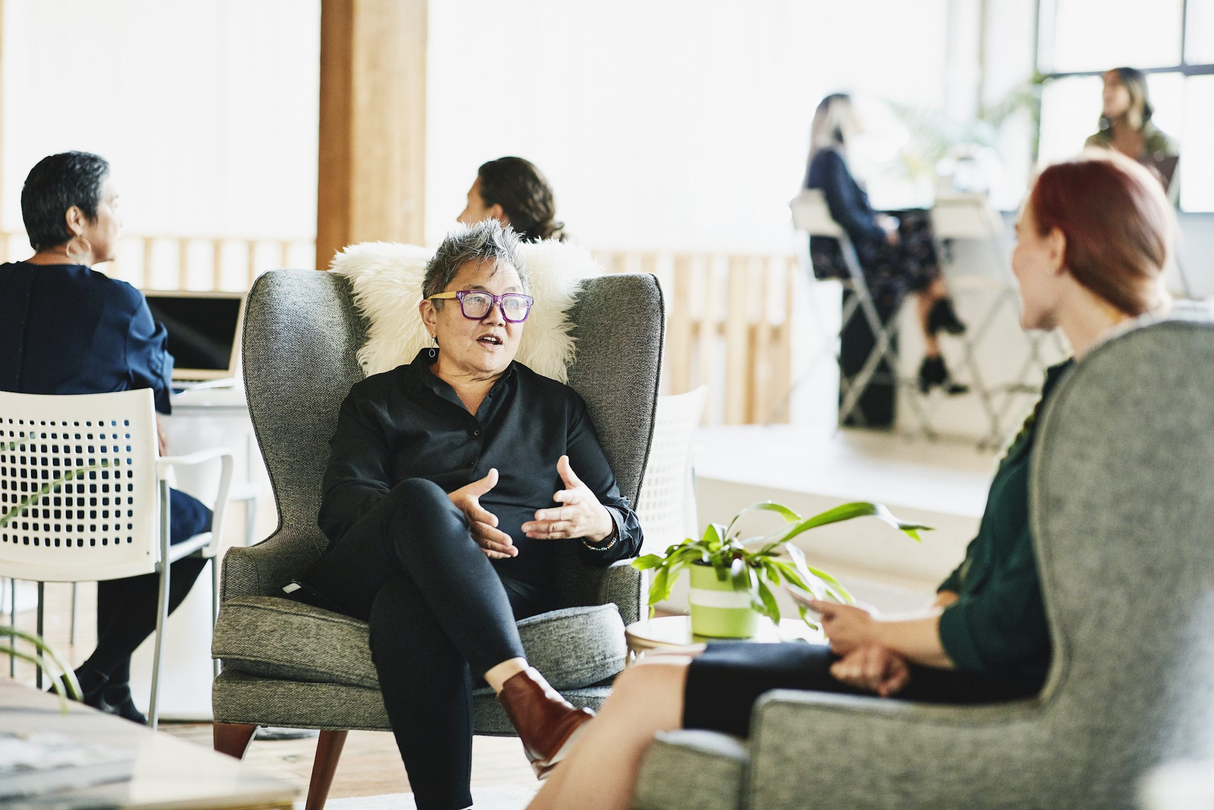 business person talking with client in the coworking space