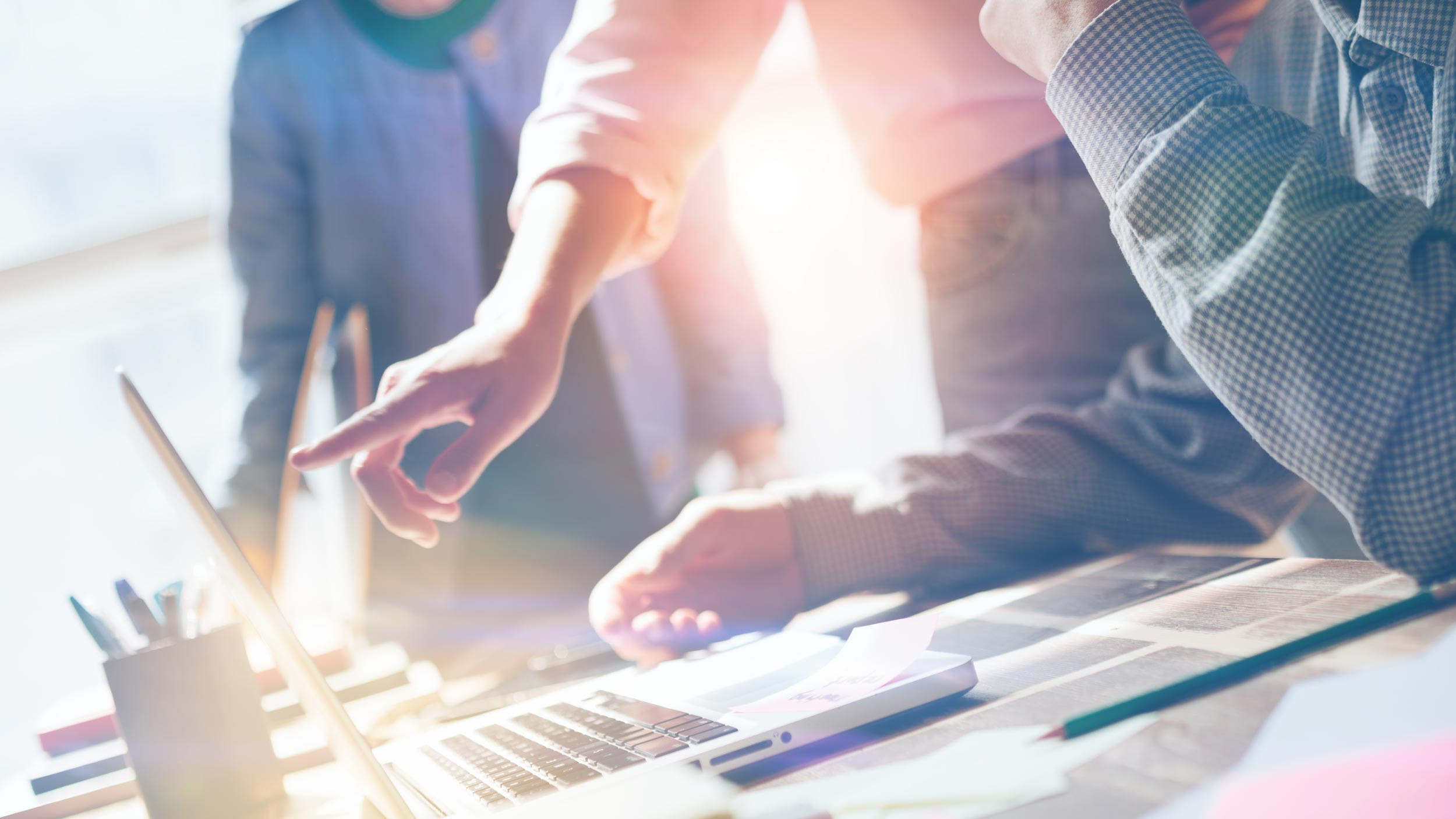 group of people consulting with the computer