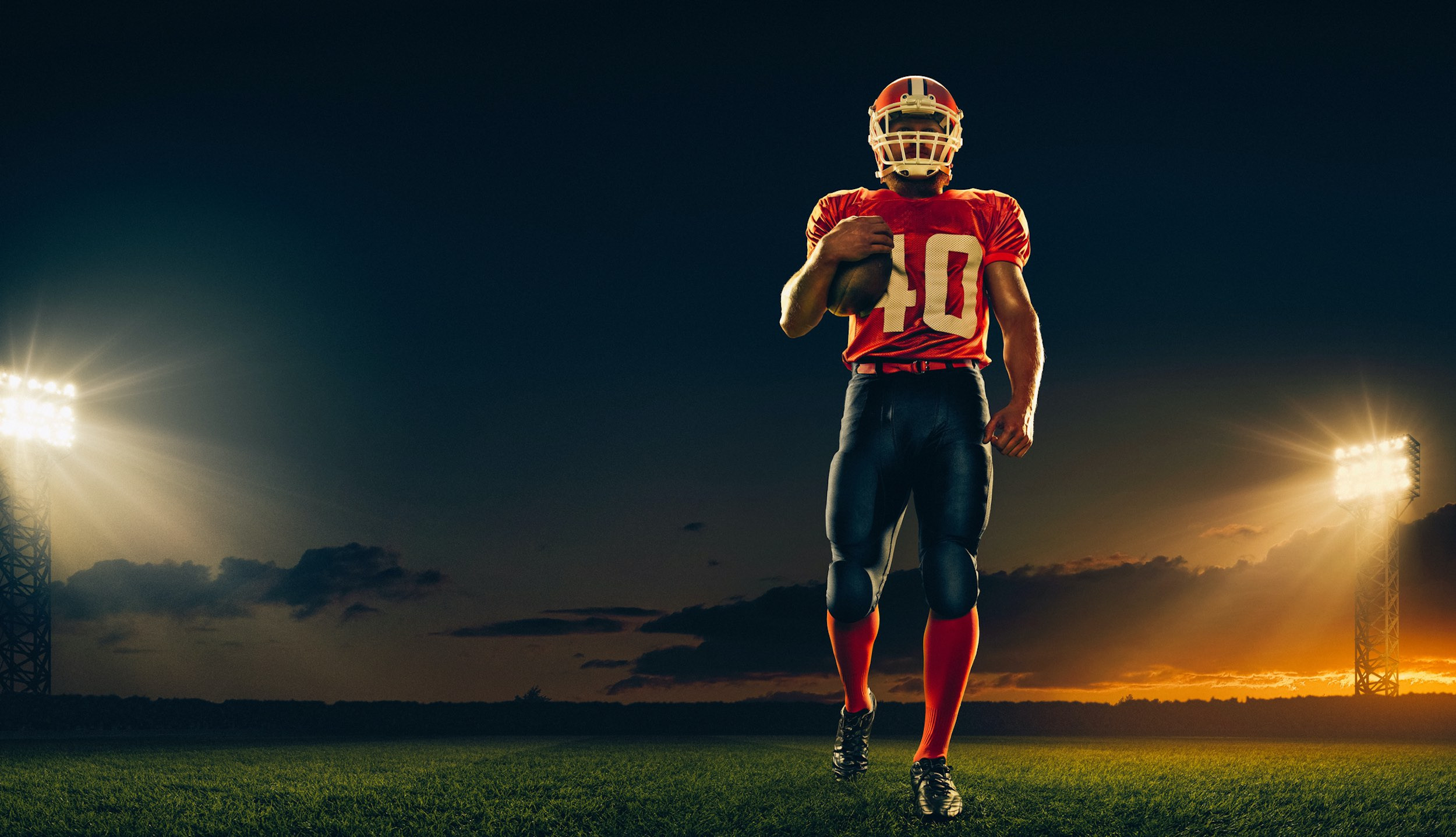 a football player wih red color jersey