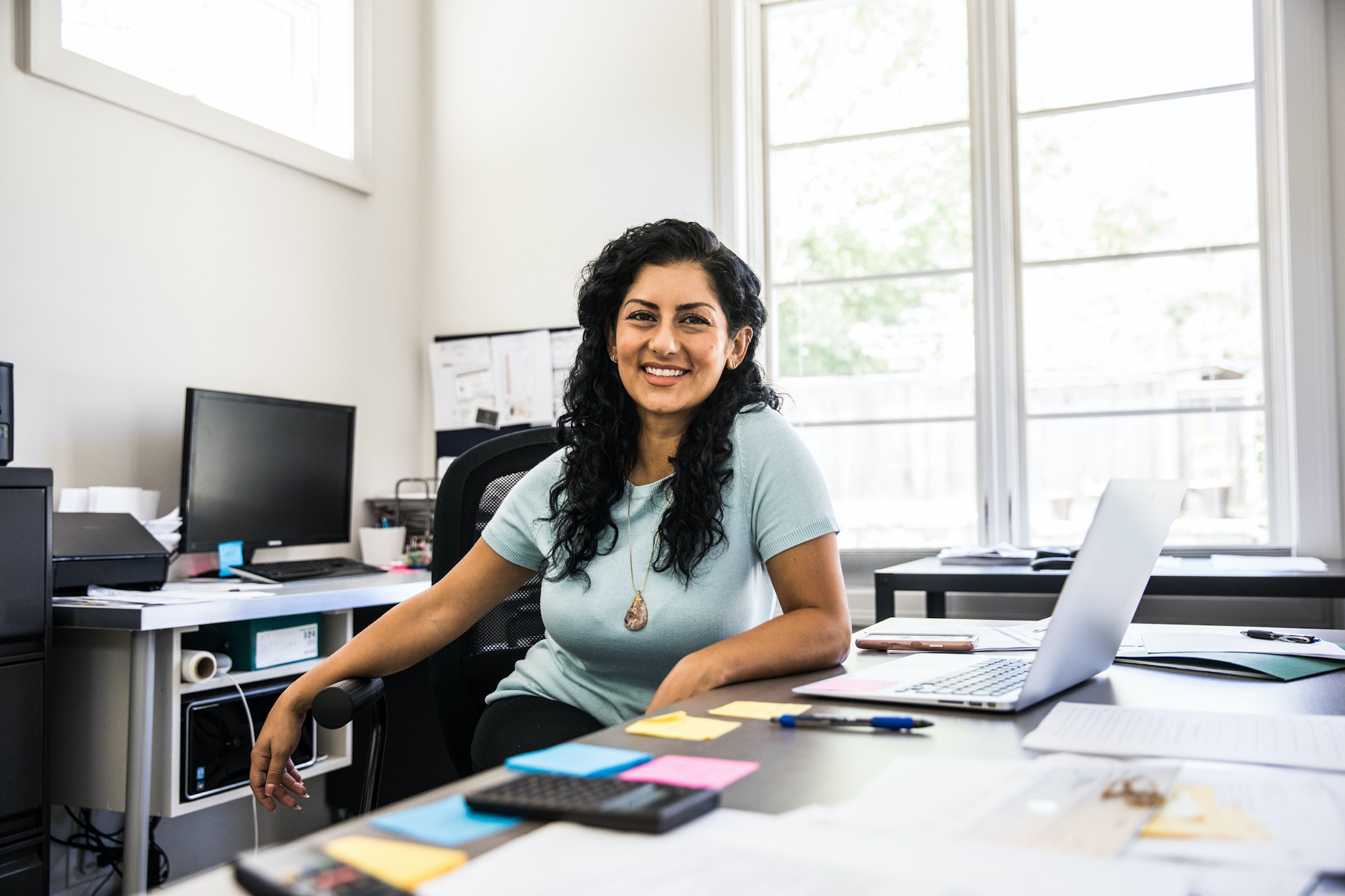 smiling person in business at office