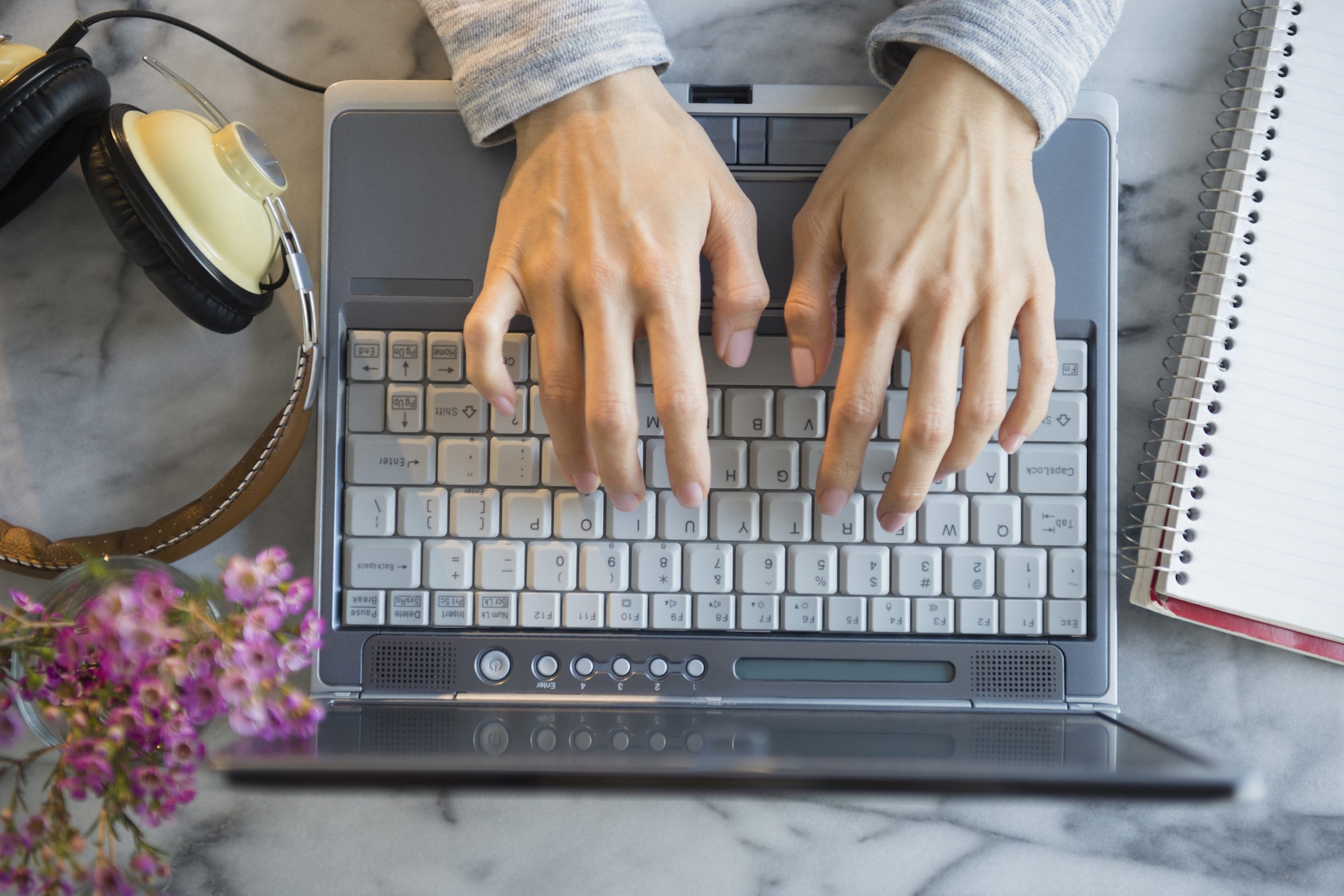 Woman reviewing business cash flow on laptop