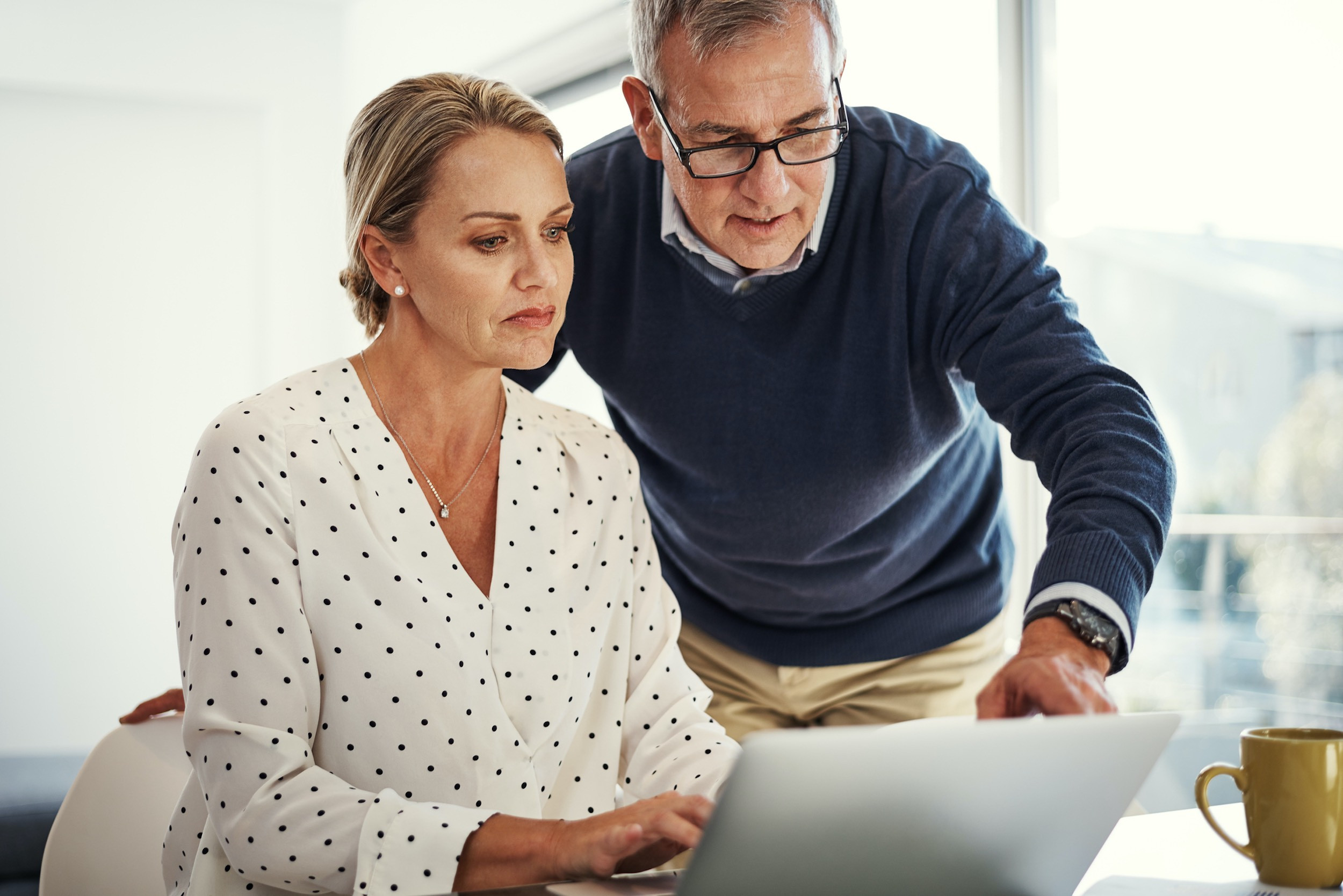 couple looking at computer with tax season