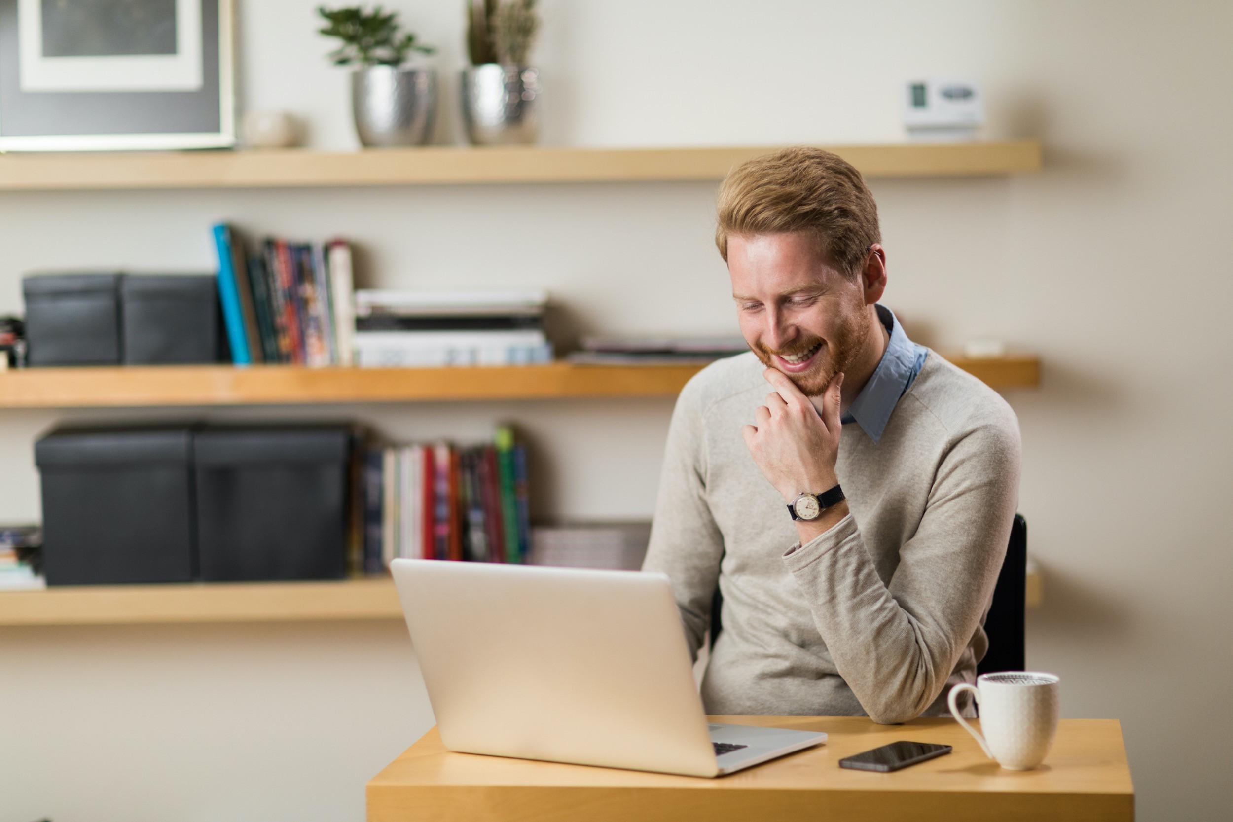 a person doing work from home and smiling