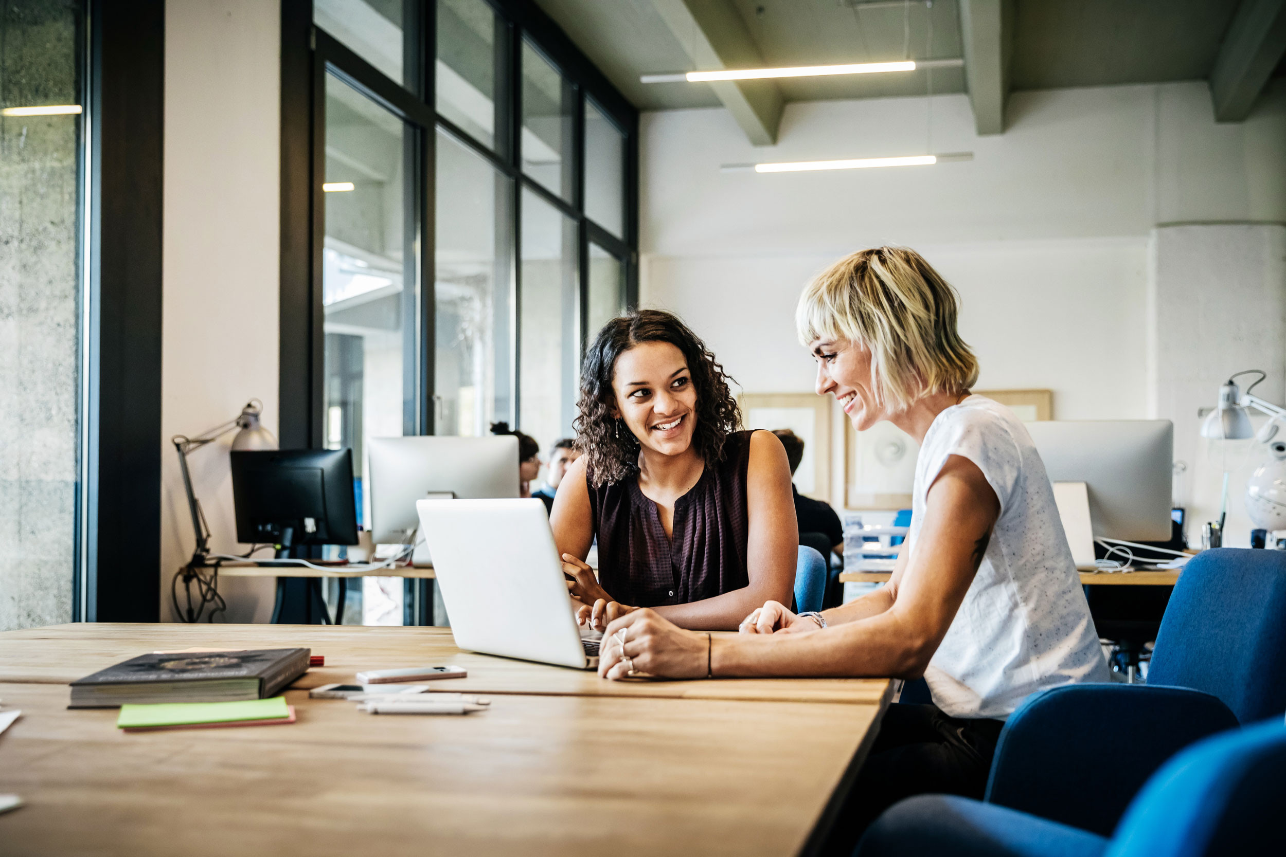 two coworkers collaborating in the office