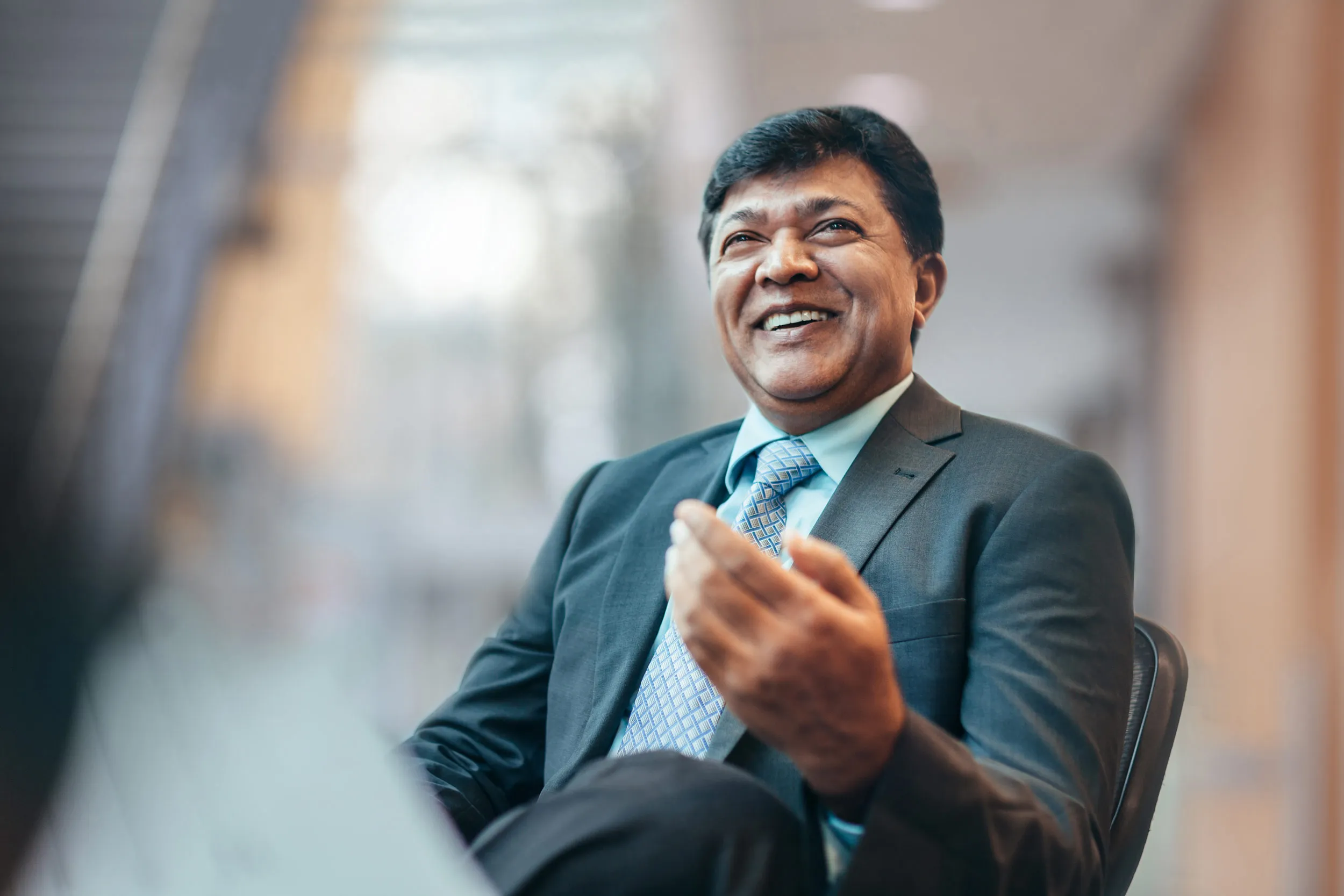 a successful senior business person happily chatting