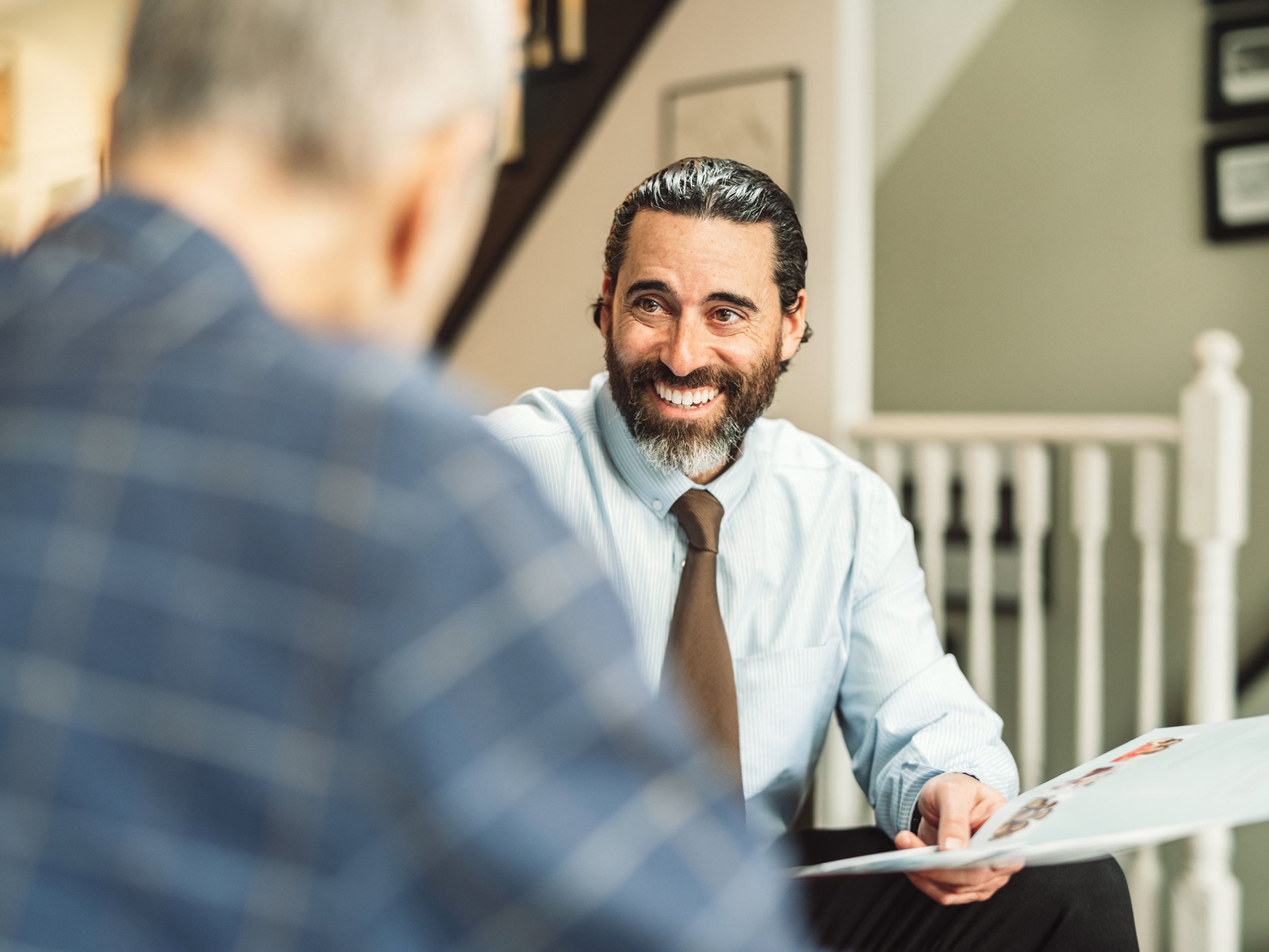 a smiling professional talking with a client