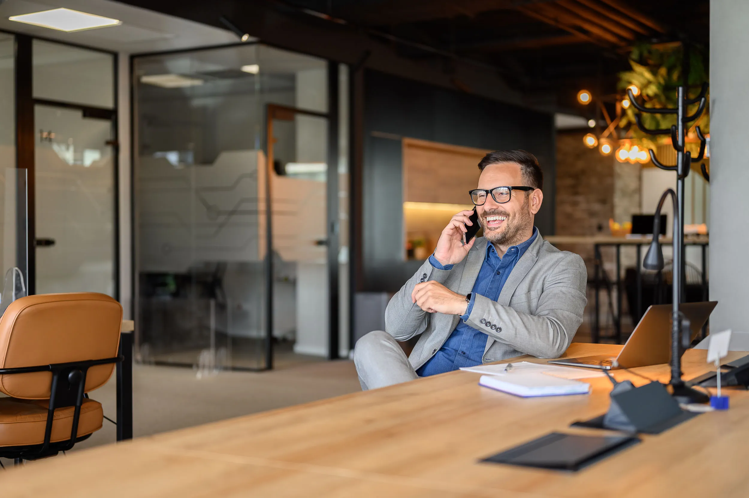 cheerful professional on the phone in the office