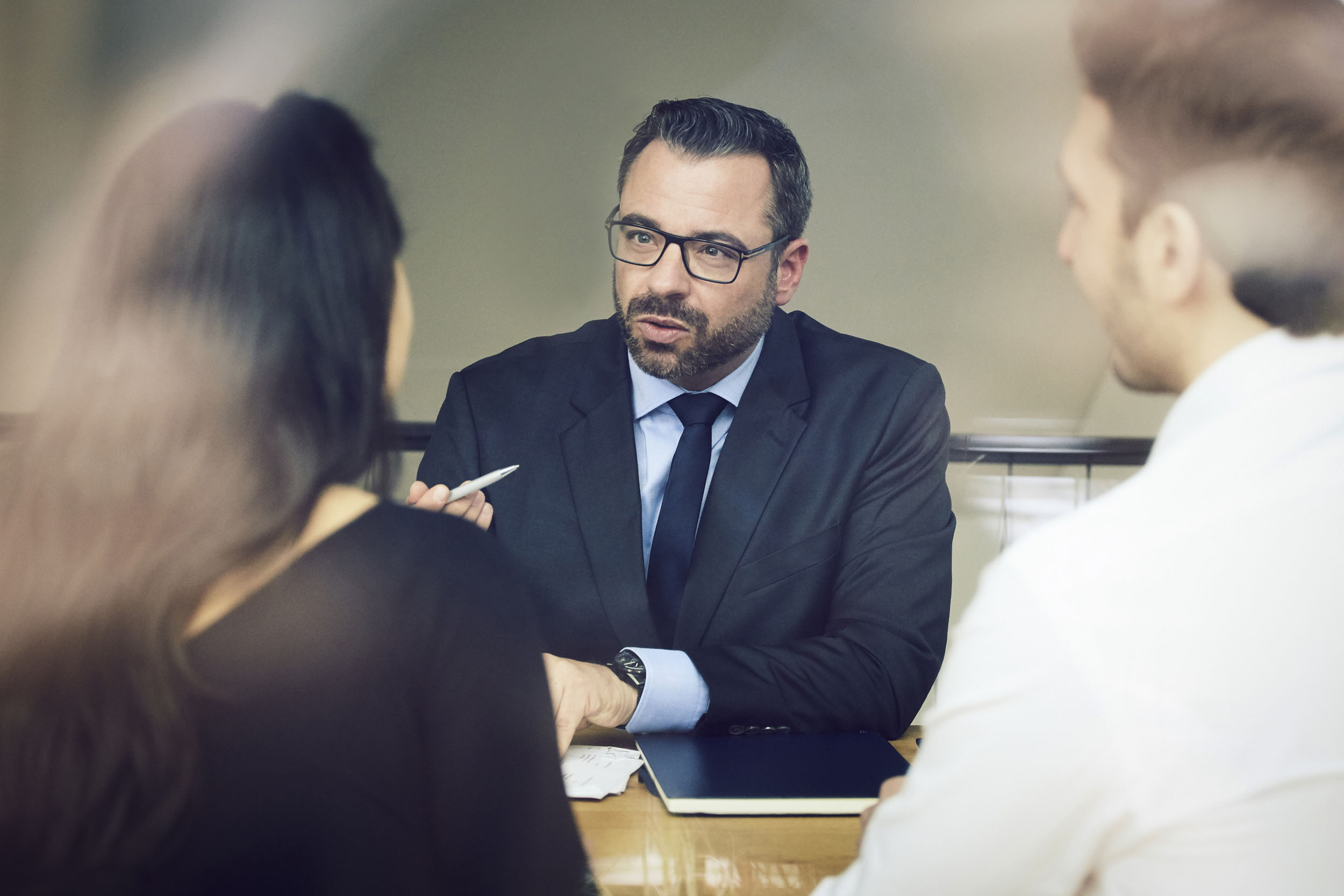 Professionals consulting at a desk