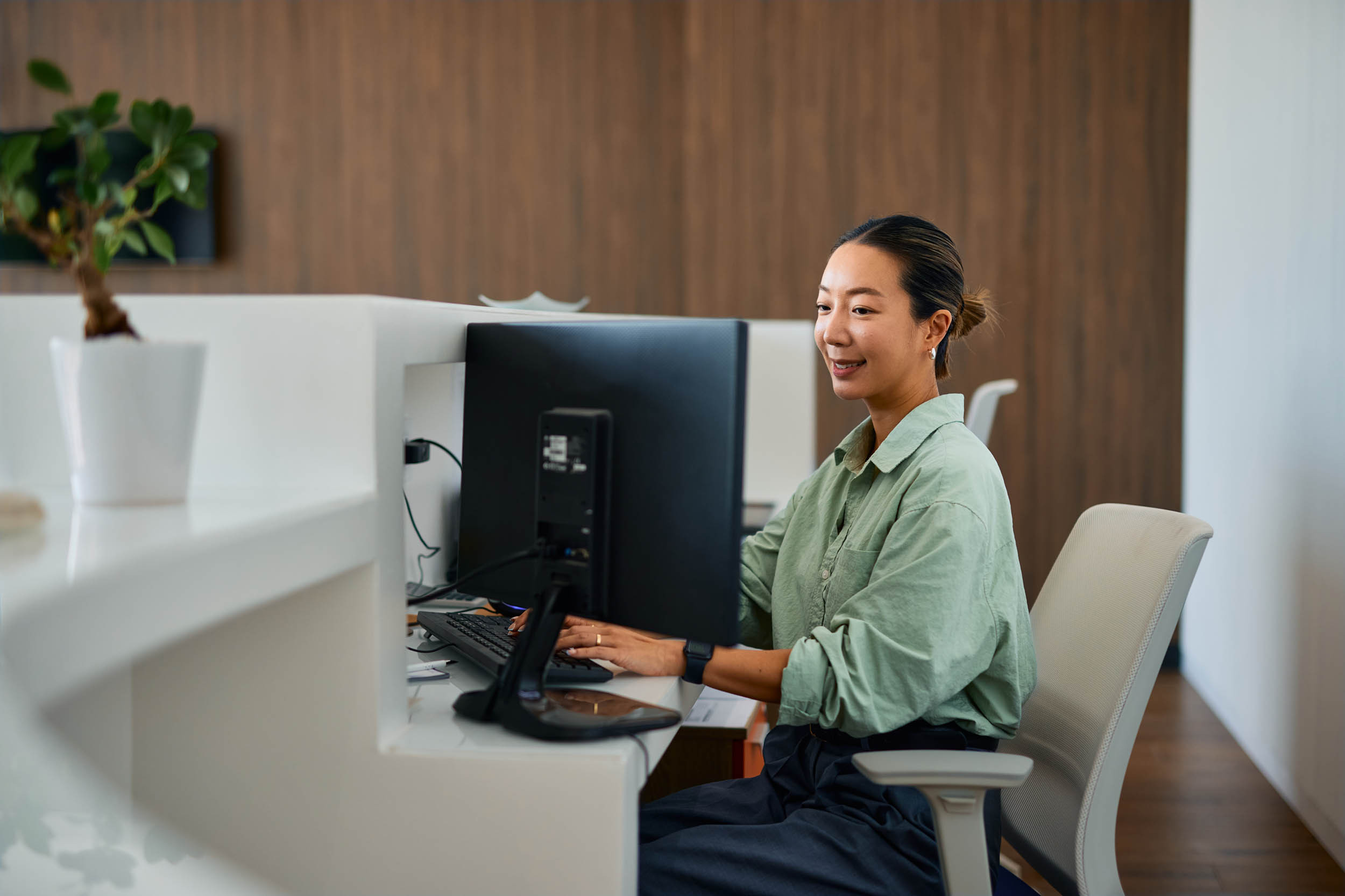 a businessperson working in a private workstation