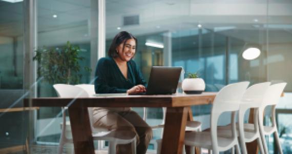 businessperson working on laptop in the office