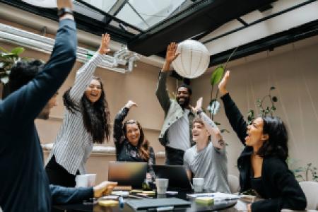 a business team celebrating after a meeting