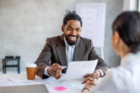 a happy work meeting between two businesspeople