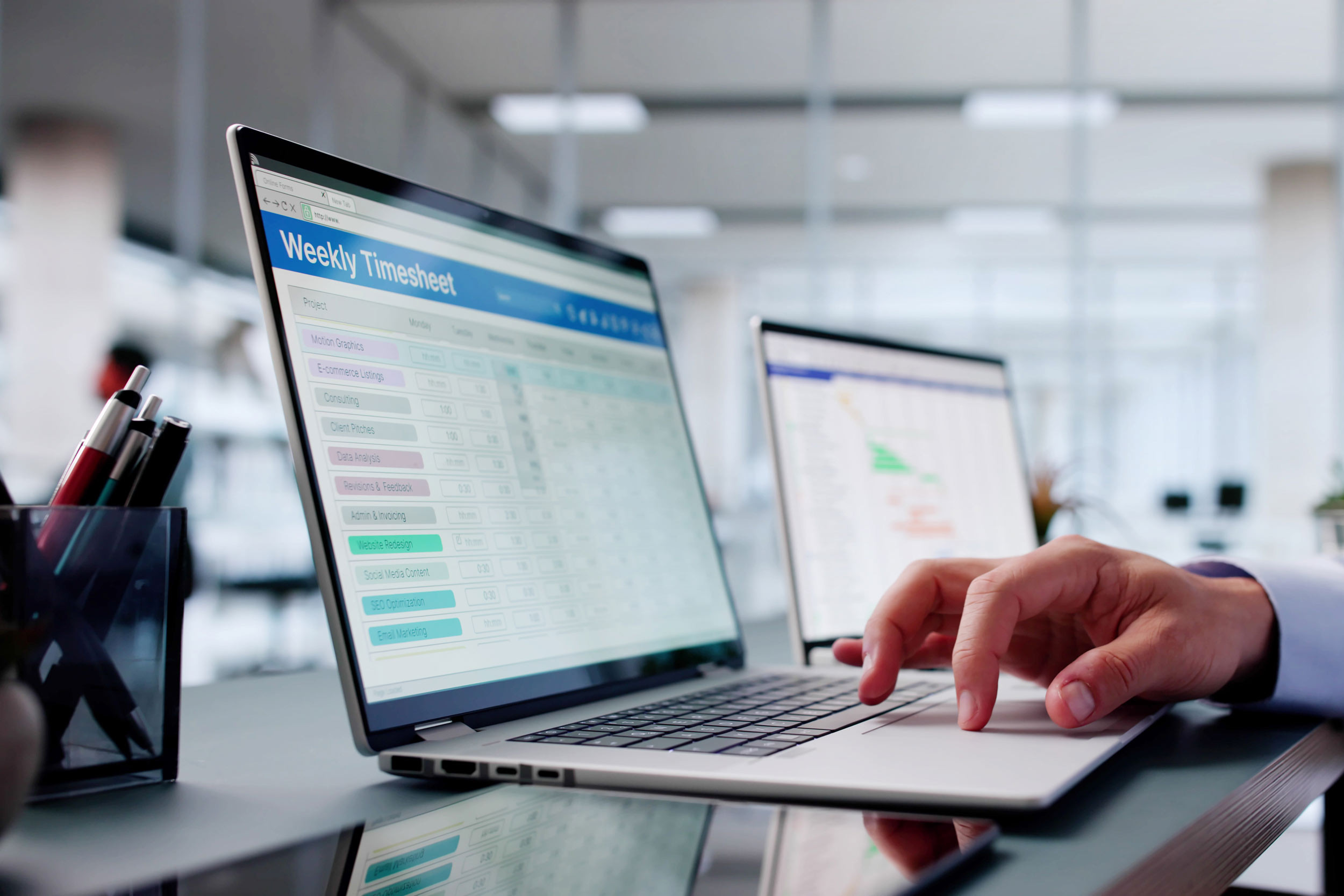 weekly timesheets shown on a computer