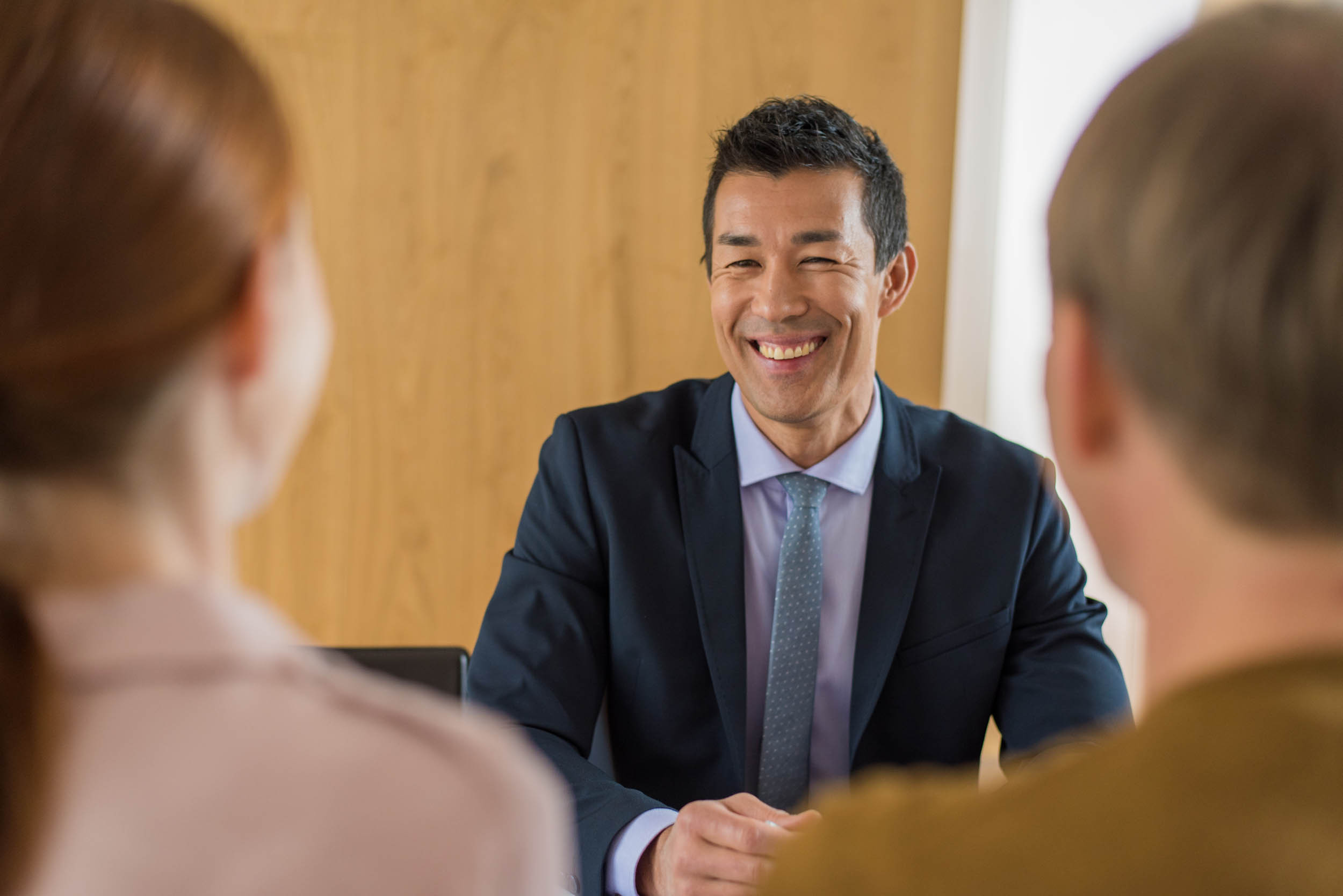 happy discussion between a consultant and two clients