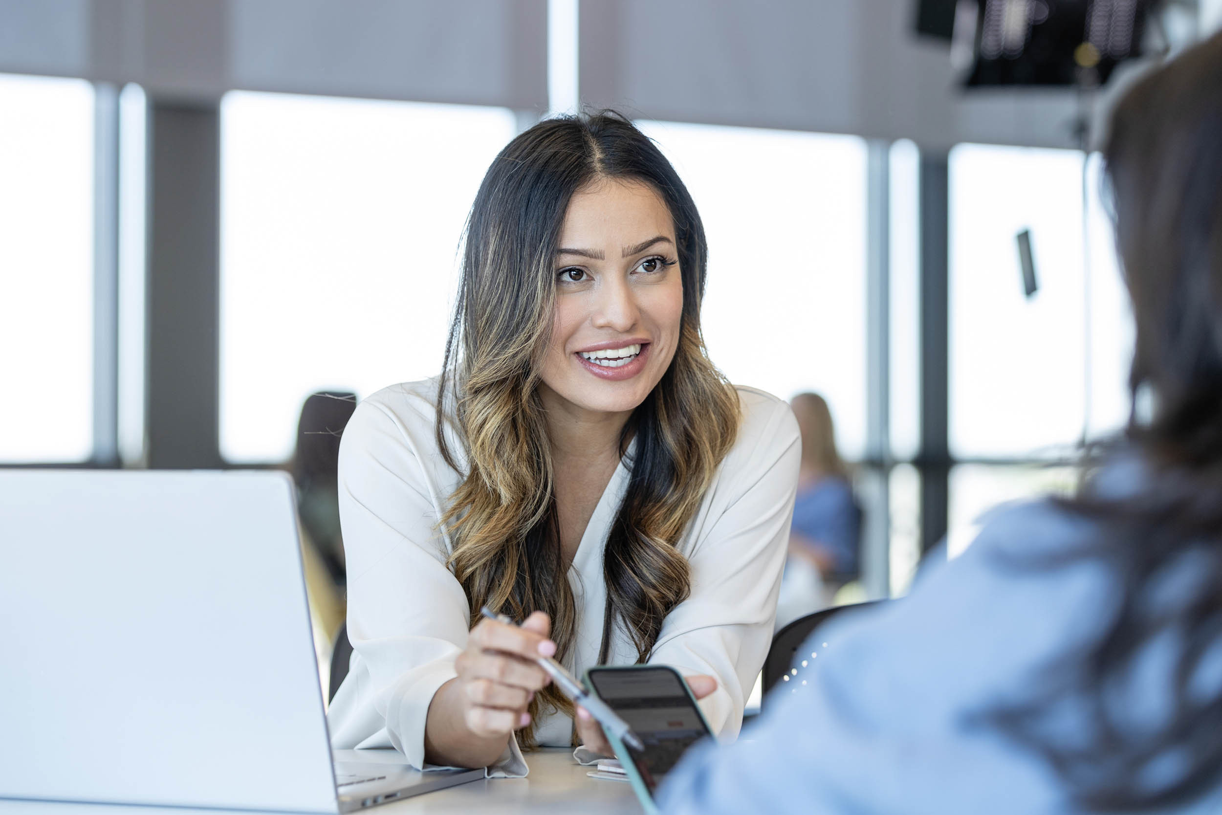 working with a client at the office