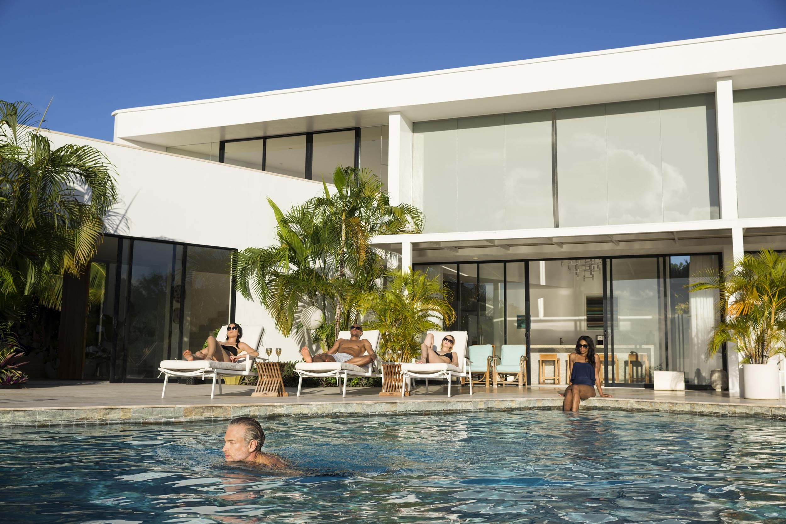 a luxurious mansion and pool