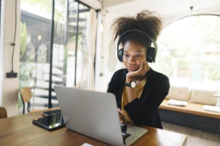 enjoying time on a laptop with headphones