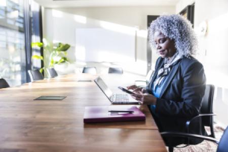 a mature businessperson in a bright office