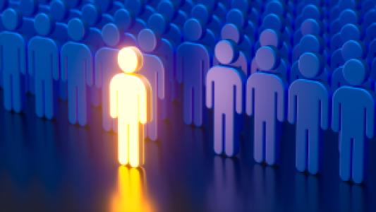 a shining leader figure in front of a crowd
