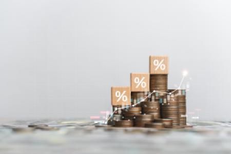 coin stacks and a graph showing investment growth
