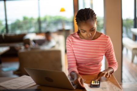 a person calculating bills and finances at home