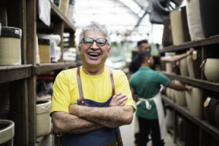 a happy pottery business owner