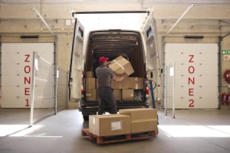 unloading delivery boxes in a business vehicle